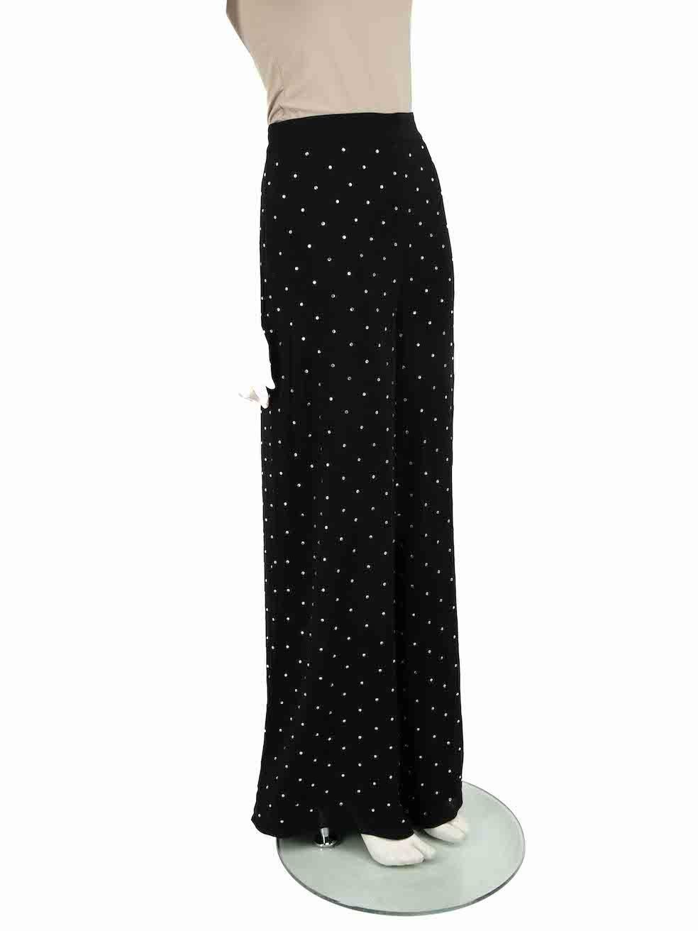 CONDITION is Very good. Hardly any visible wear to trousers is evident on this used Temperley London designer resale item.
 
 
 
 Details
 
 
 Tin model
 
 Black
 
 Viscose
 
 Wide leg trousers
 
 High rise
 
 Crystal embellished accent
 
 Side zip