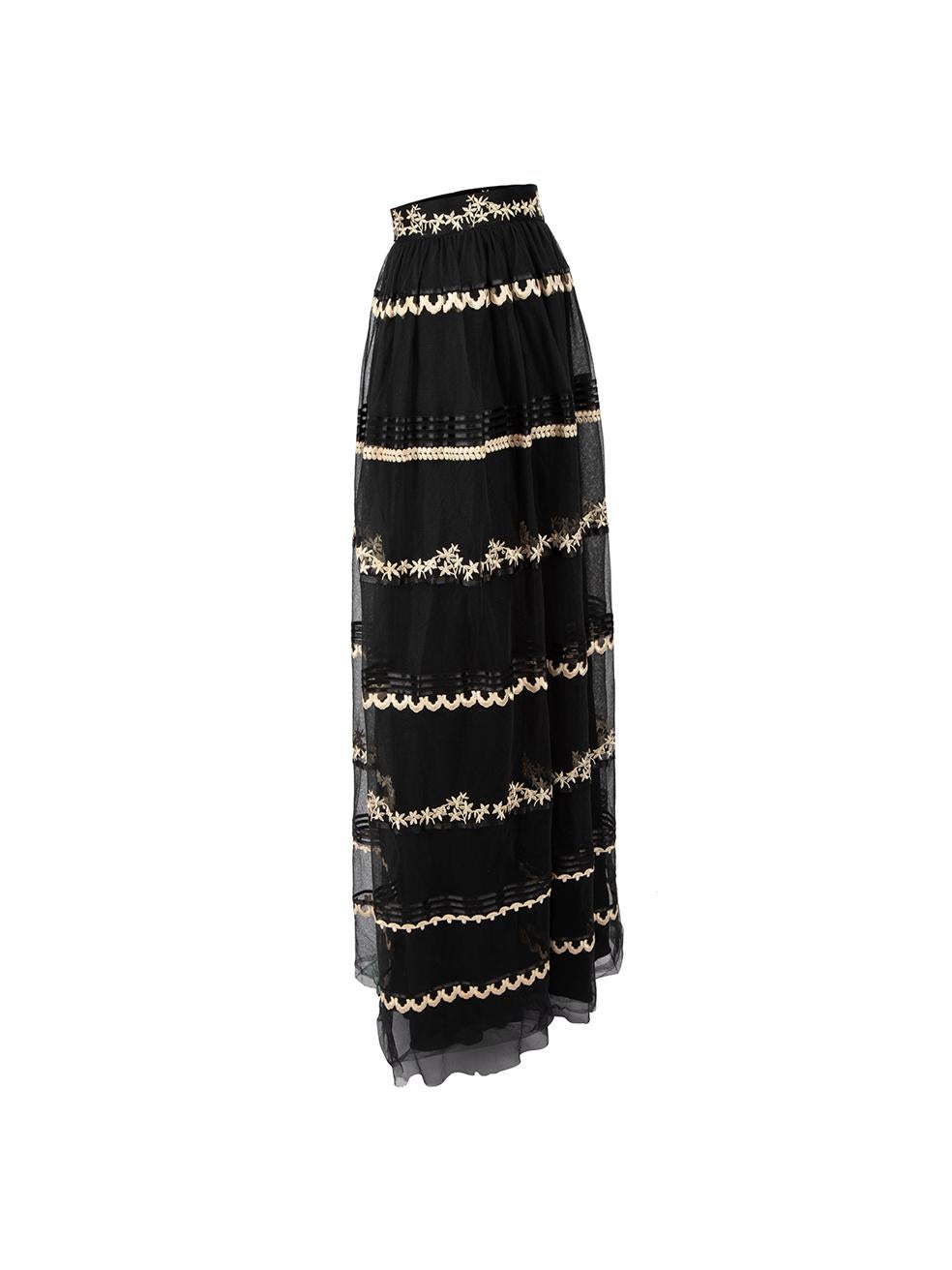 CONDITION is Good. General wear to skirt is evident. Moderate signs of wear to tulle layer with slight rips around the bottom of skirt on this used Temperley designer resale item.



Details


Black

Polyester

Full skirt

Layered tulle

Beige