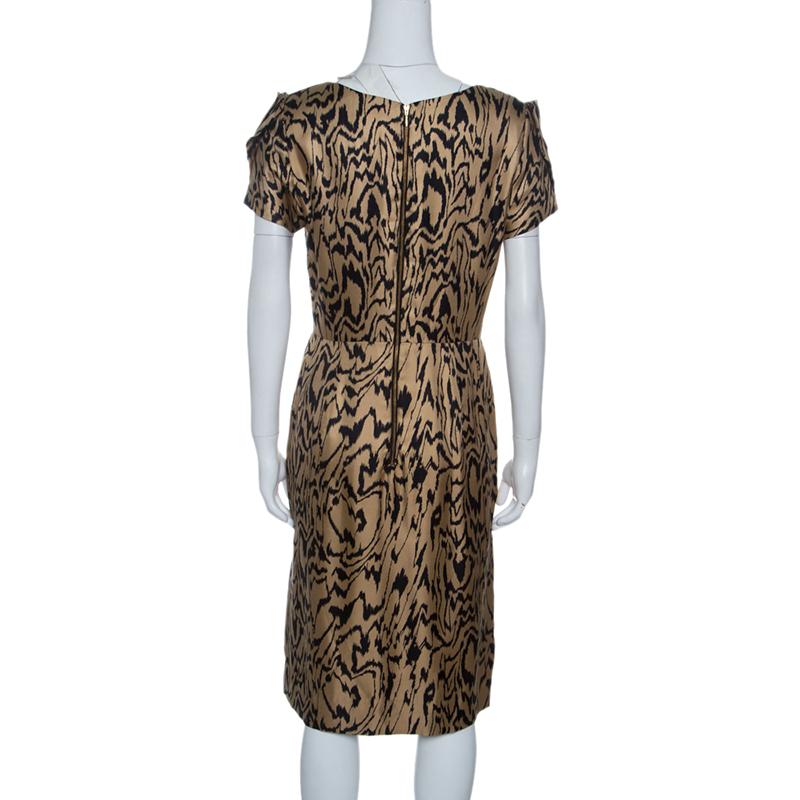 Make a lasting impression dressed in this Temperley London dress. Tailored in a brown and black printed silk body, this dress offers a relaxed fit to the wearer and falls to the knee. It features short, puffed sleeves and completed with a rounded