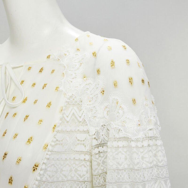 TEMPERLEY LONDON white sheer gold jacquard crochet lace bohemian top US4 S
Reference: KNLM/A00182
Brand: Temperley London
Collection: 2018
Material: Viscose, Silk
Color: White, Gold
Pattern: Lace
Closure: Self Tie
Extra Details: Tie neck strings.