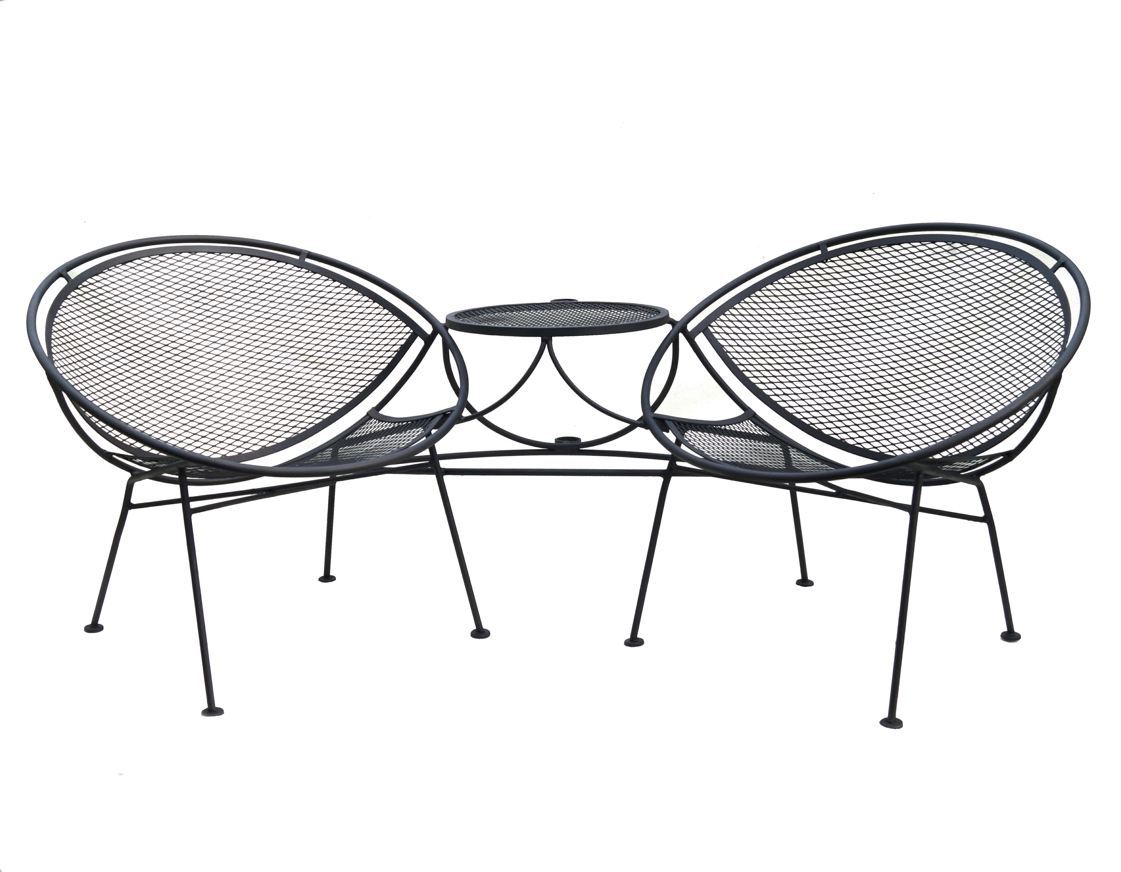 John Salterini Tete a Tete  which has 2 chairs , table and an umbrella holder , if you want shade .  It is all one piece. For Outdoor , Indoor ,  Patio, Pool .  We also have the footrest / ottoman in our other items, which you could add on to this.