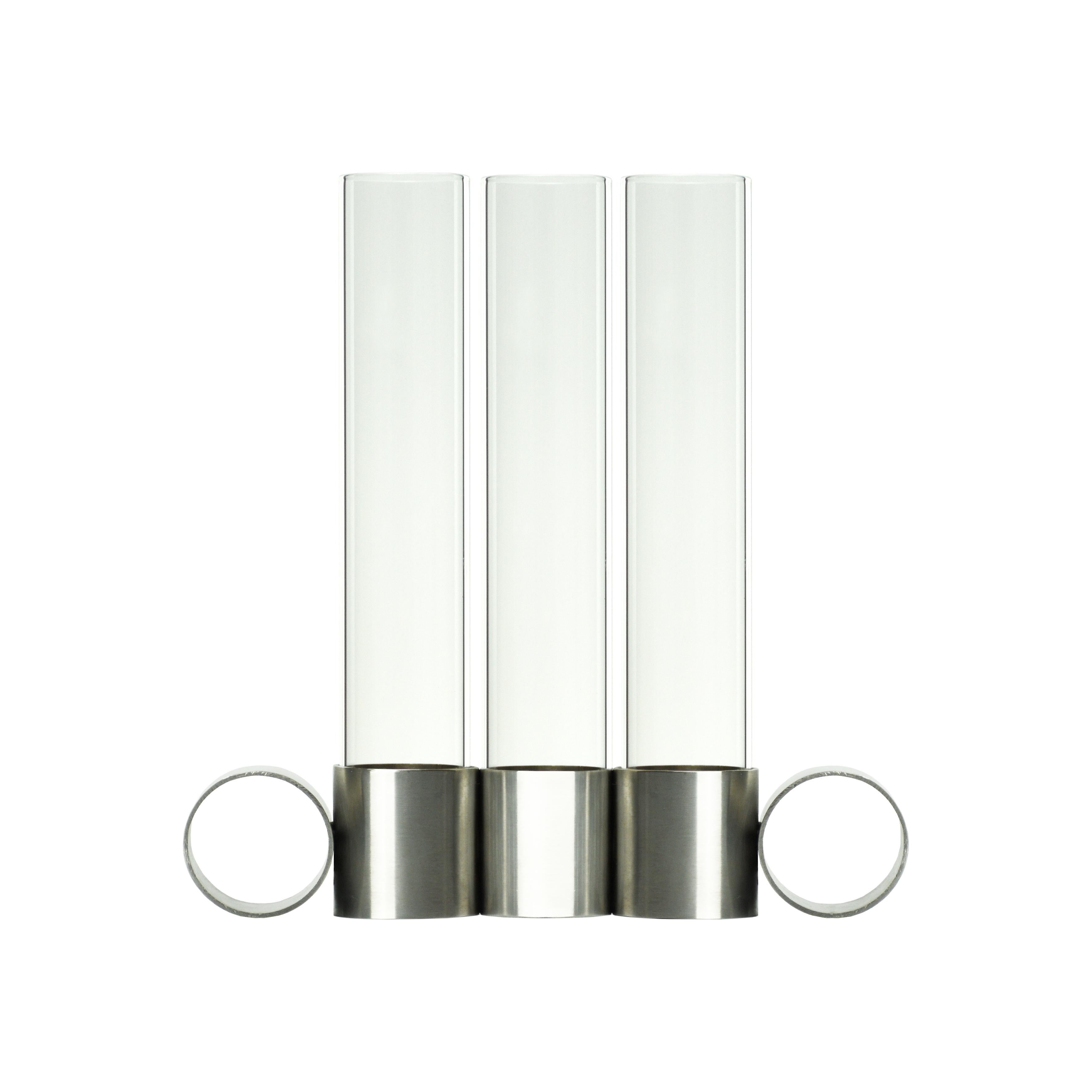 Tempio del Tempo 3 candleholder by Coki Barbieri
Dimensions: W 20 x D 4 x H 20 cm.
Materials: stainless steel (made in Italy), borosilicate glass (made in Italy), soy wax or olive oil wax candle and TPE rubber.

FEATURES
7 divided