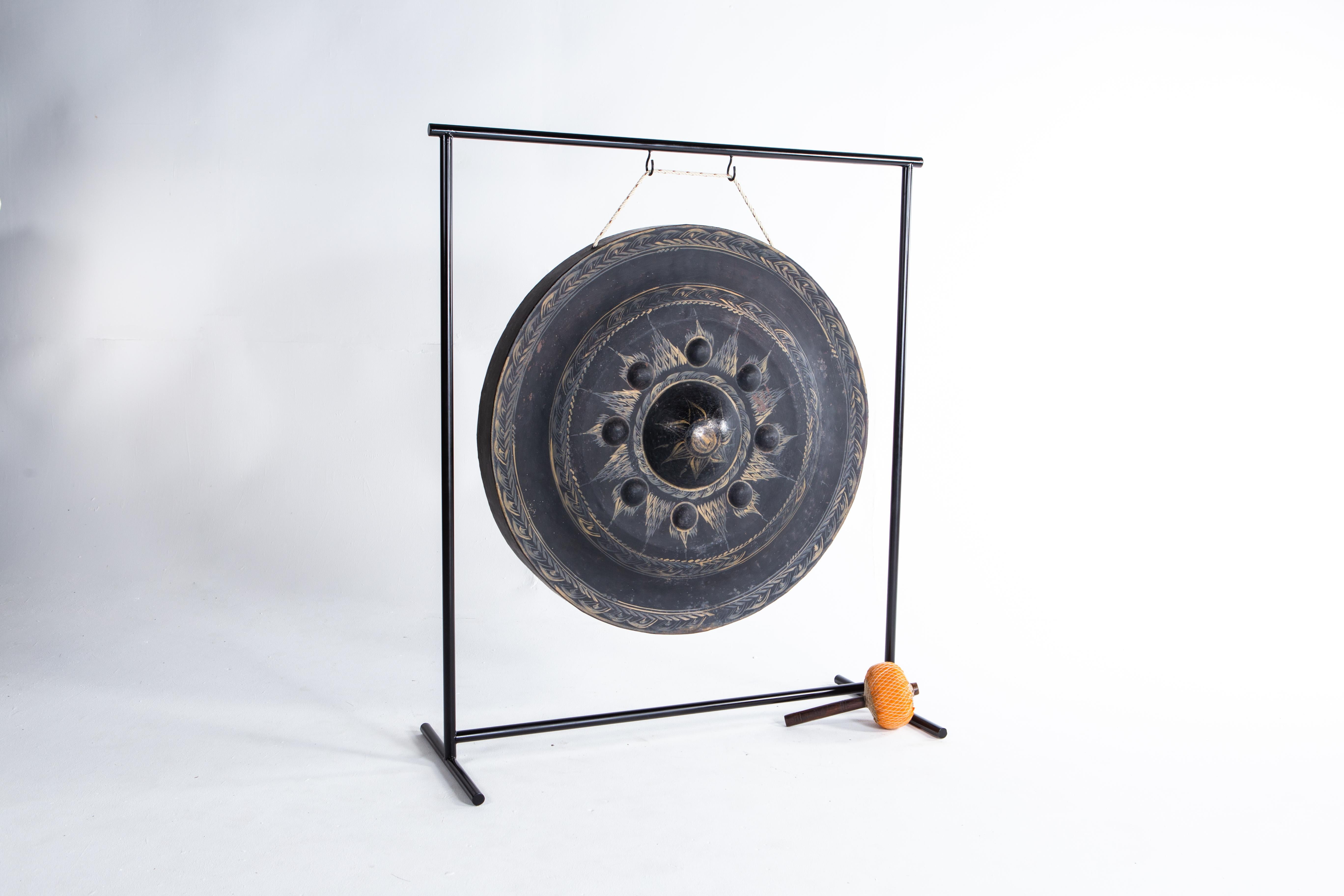 This metal gong was once given to a temple to gain merit for the giver. According to Buddhist belief, meritorious gifts help one achieve a higher reincarnation. So many gongs are given to temples that monks often trade them for other articles.