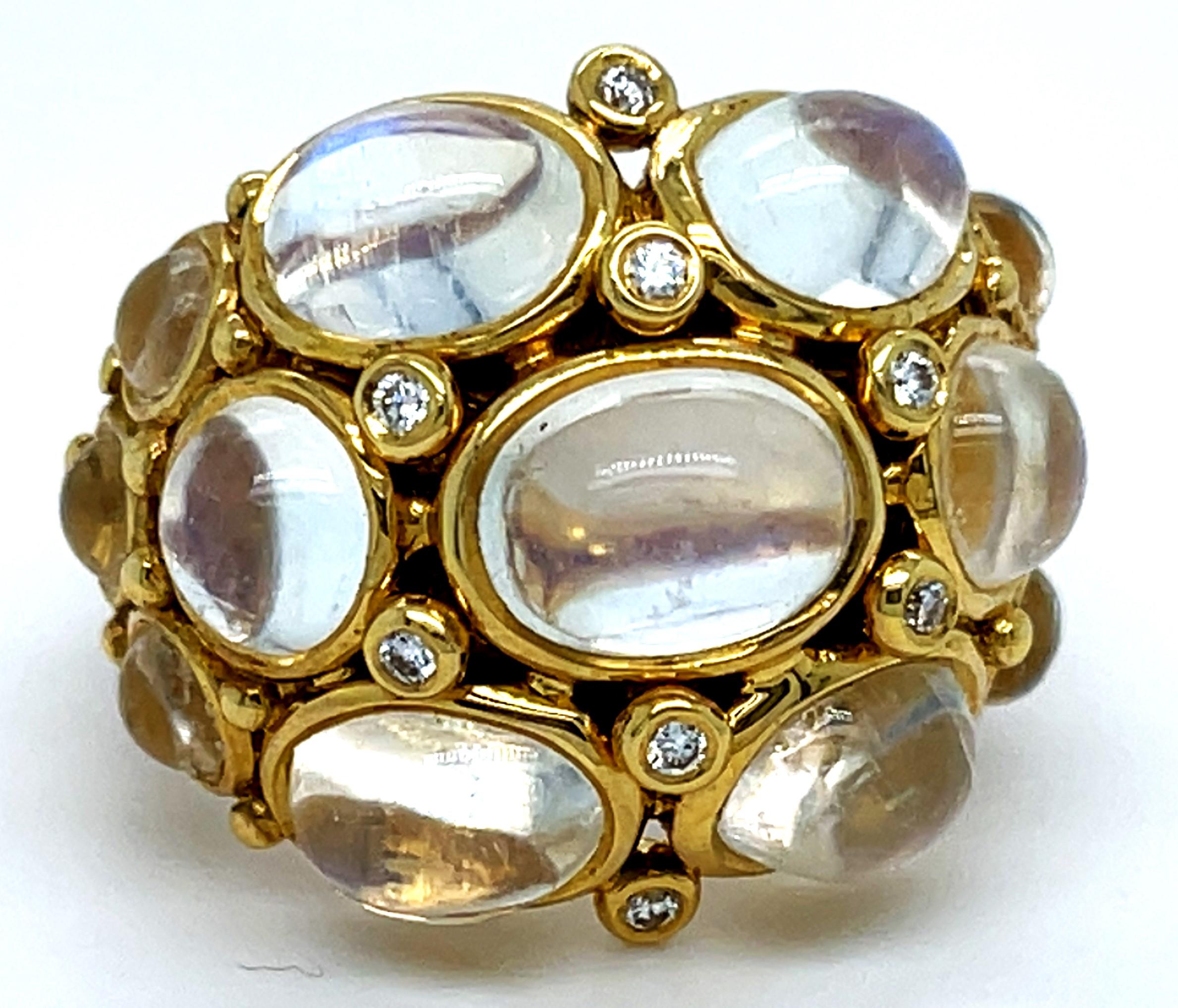 Gorgeous Moonstone Bombe Ring by Temple St. Clair
Features Appx 11.25 ct of Moonstone Cabochons in Gold Bezel Settings
Interspersed are appx 0.12 ct of Small Diamond Accents in Gold Bezel Settings
Width of Ring = 21 mm
Width of Band at Reverse = 6