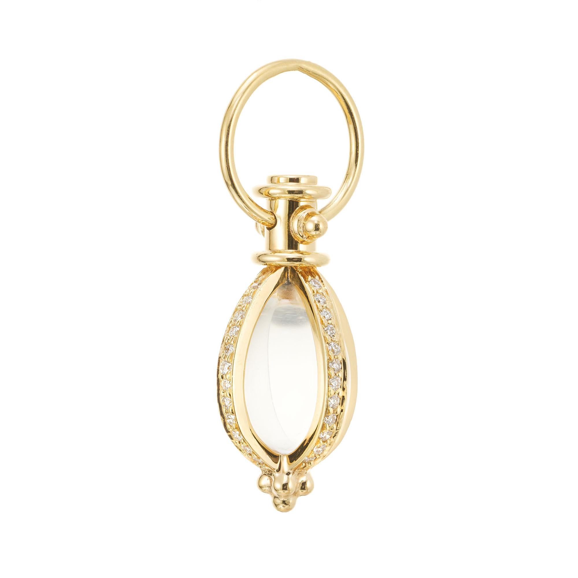 Temple St Clair pave diamond and quartz crystal amulet pendant. The focal point of this piece is a mesmerizing quartz crystal which is ensconced in 18k yellow gold with 48 pave diamonds along each row. This exquisite pendant showcases the perfect