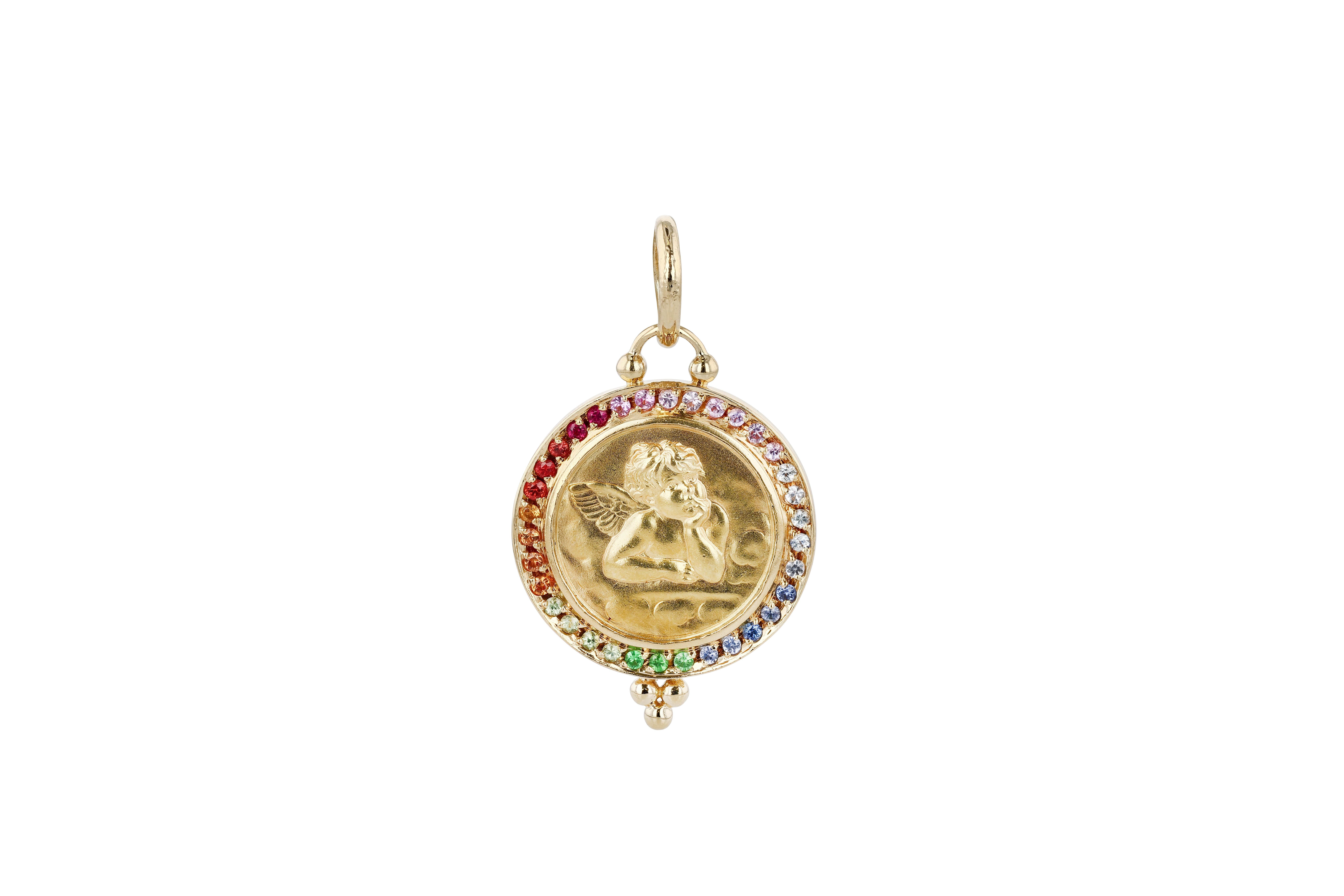 A gold and multi-colored sapphire cherub pendant by renowned contemporary jewelry designer Temple St. Clair.

The cherub is rendered in a satin finished hammered gold, the cherub pictured in a position of contemplative repose. The bottom of the