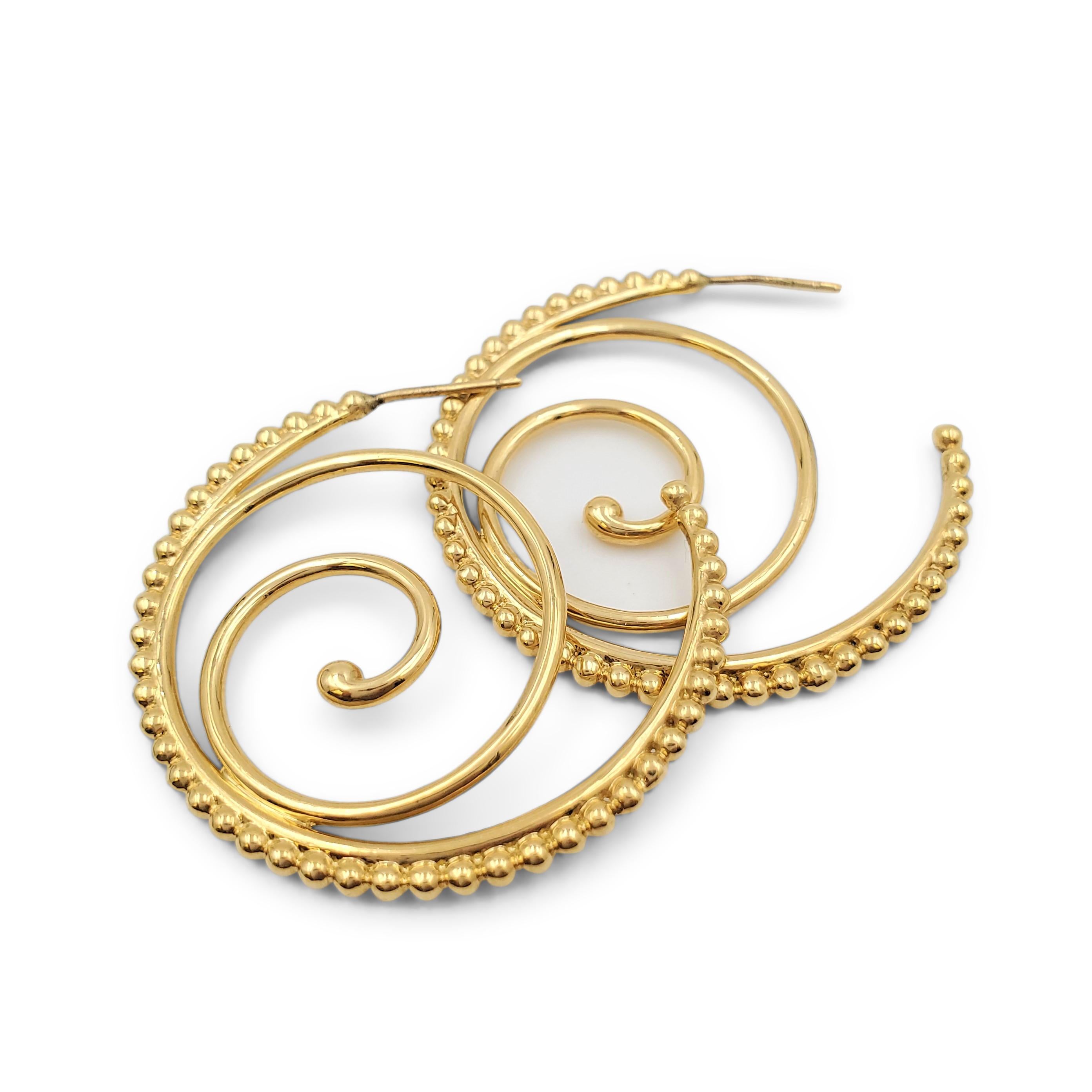 Authentic Temple St. Clair 'Midnight Oasis Arabesque' hoop earrings crafted in 18 karat yellow gold. Elegant swirled hoop earrings with gold beading accents along the outer edge. The earrings are stamped 750 and signed with the Temple St. Clair