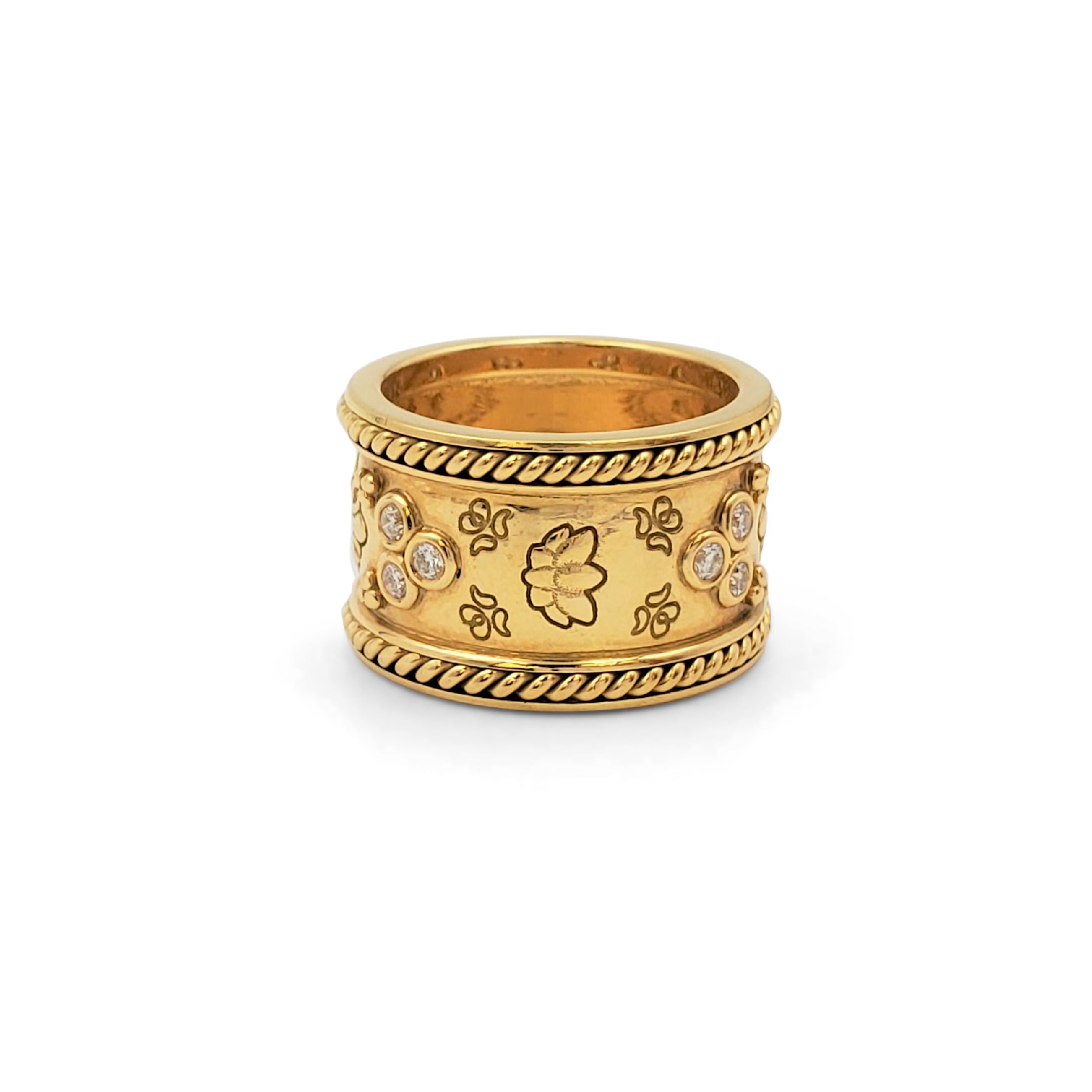 Authentic Temple St. Clair 'Nomad' band ring crafted in 18 karat yellow gold comprised of trio's of bezel-set round brilliant cut diamonds, etched floral patterns, and trios of tiny gold beads. The ring is framed on either edge with a gold rope