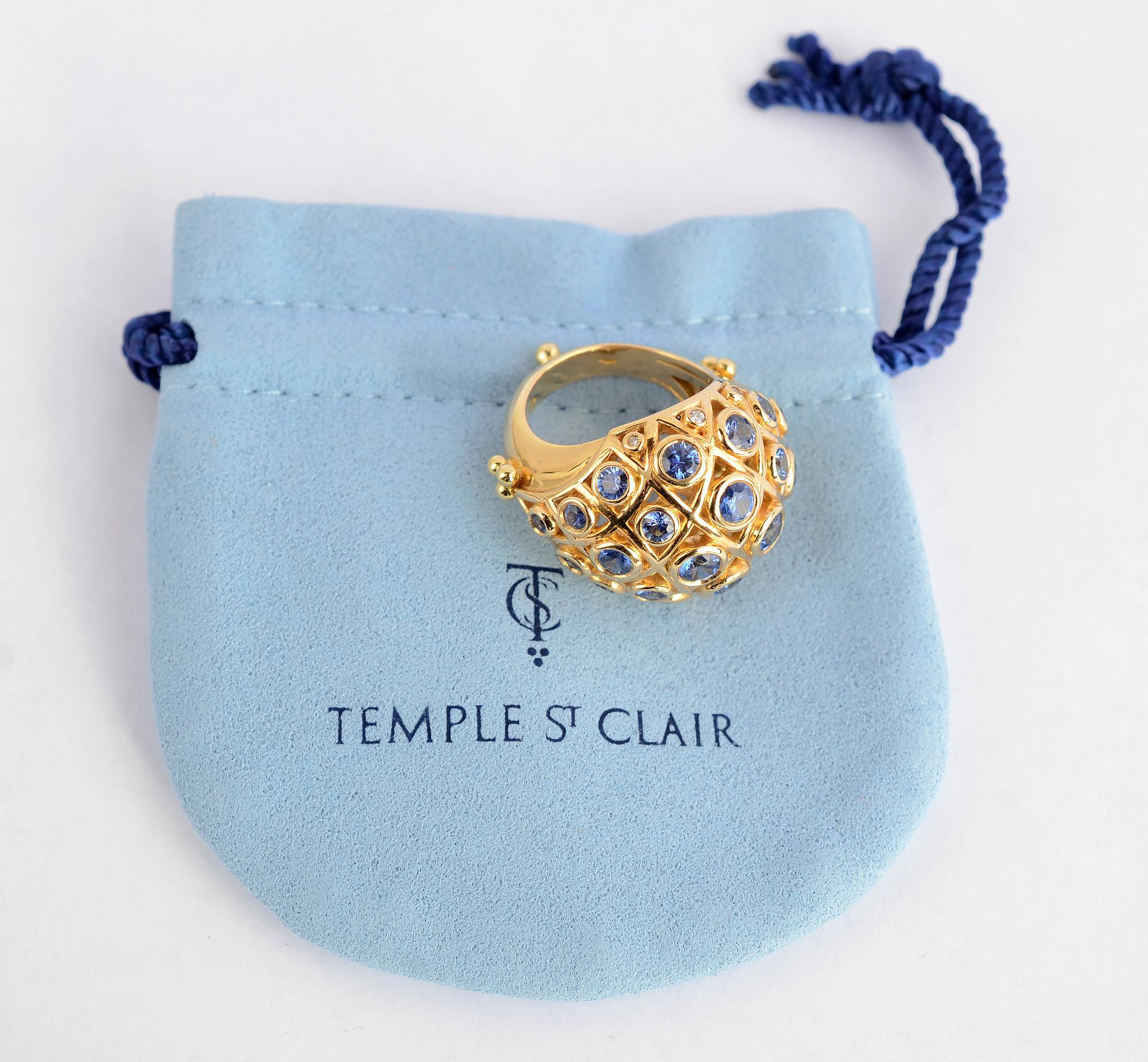 Exquisite domed ring with round sapphires and diamonds by Temple St. Clair. 
The ring has 23 sapphires that are graduated in size. There are 6 diamonds on the bottom row. The ring has St. Clair's signature gold ball on the back of the shank as well