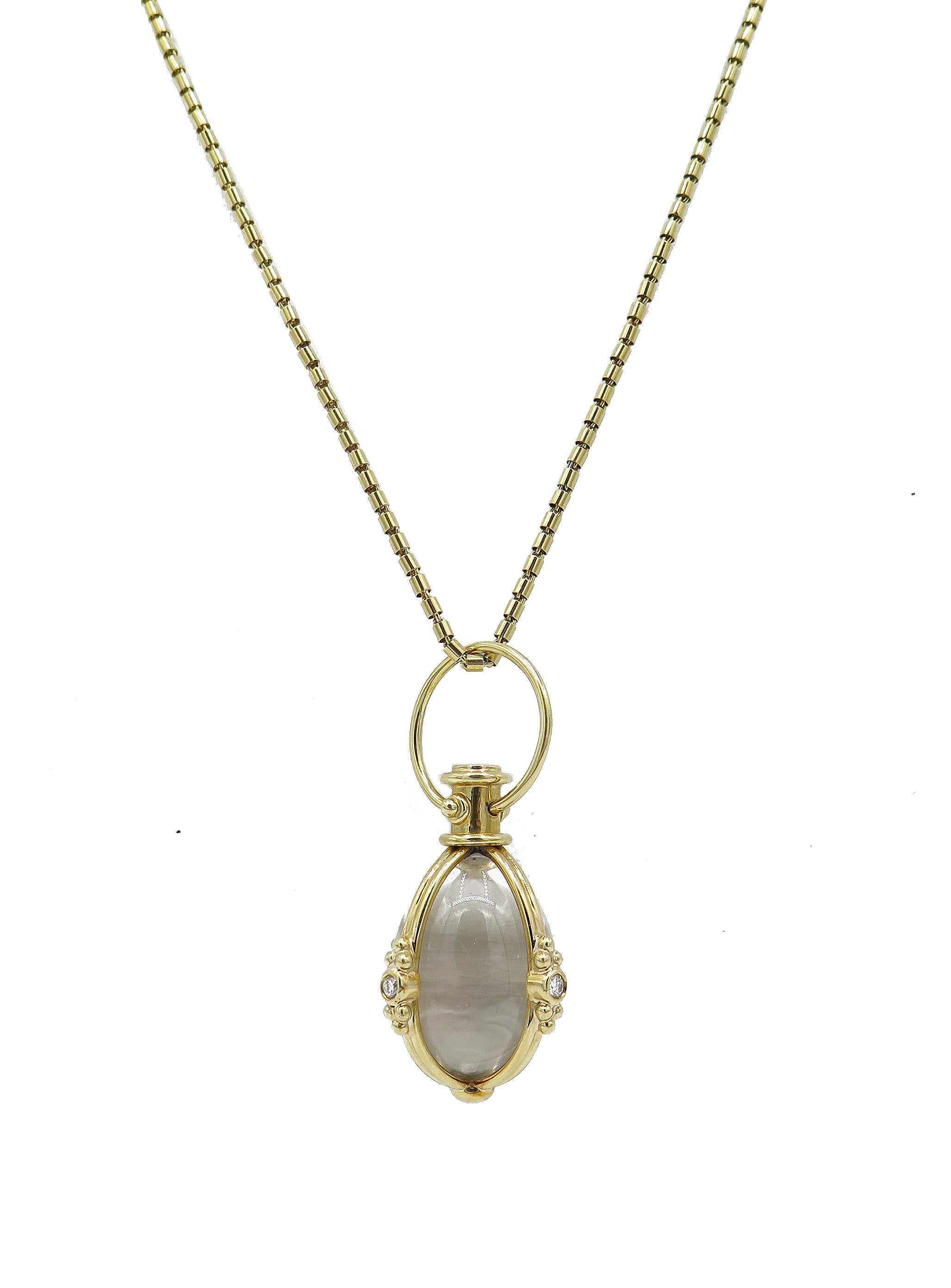 Gorgeous Temple St. Claire Pendant with Polished Rock Crystal and Diamonds. Ornate and elegant, this neck jewel is 18k yellow gold with 0.24cts of diamonds set in the delicate detail of the oval setting. The pendant measures 2 inches long and 0.9
