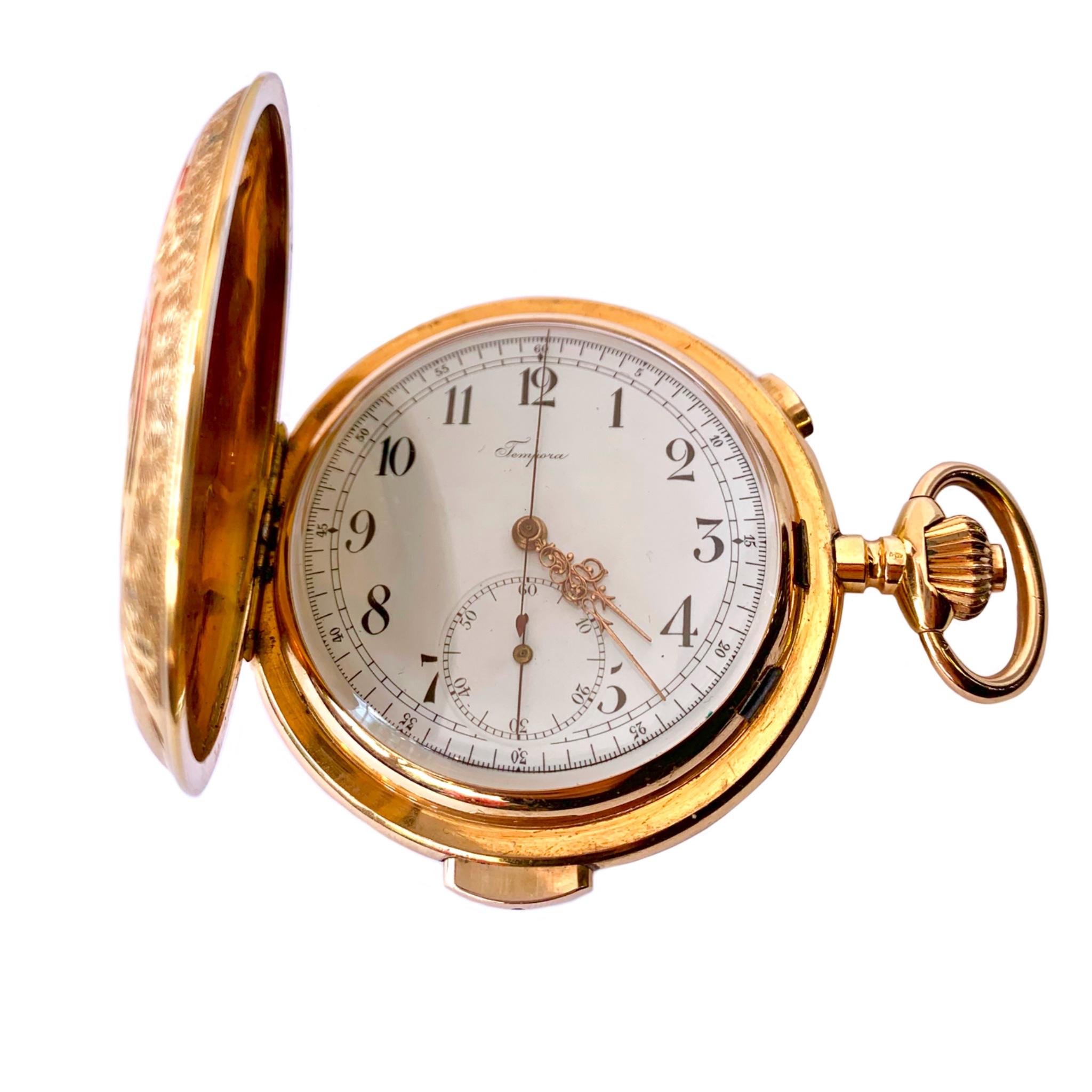 Collectors dream! 18K yellow gold Tempora hunting case engraved pocket watch. The repeater chronograph 25 jewel movement chimes the hours, quarter hours and minutes. The serial number is 13244, case #394042 and the case measures 57 mms. Circa early