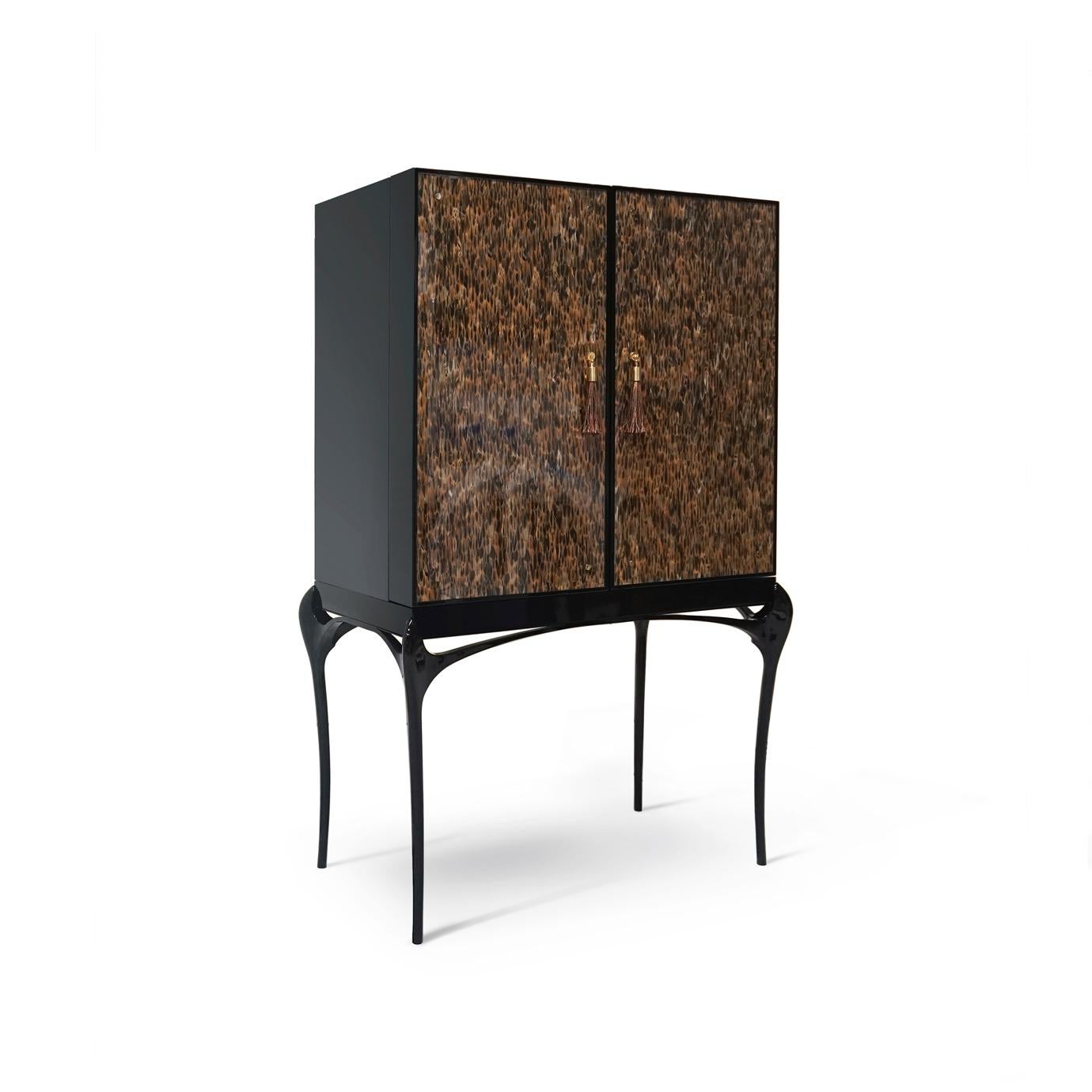 Enticing admirers with its exotic feather doors and sexy curved lacquered legs, the Temptation Bar Cabinet will steal cocktail hour. The chic black and gold interior is perfectly designed to store your wine and cocktail accouterments. Open or closed