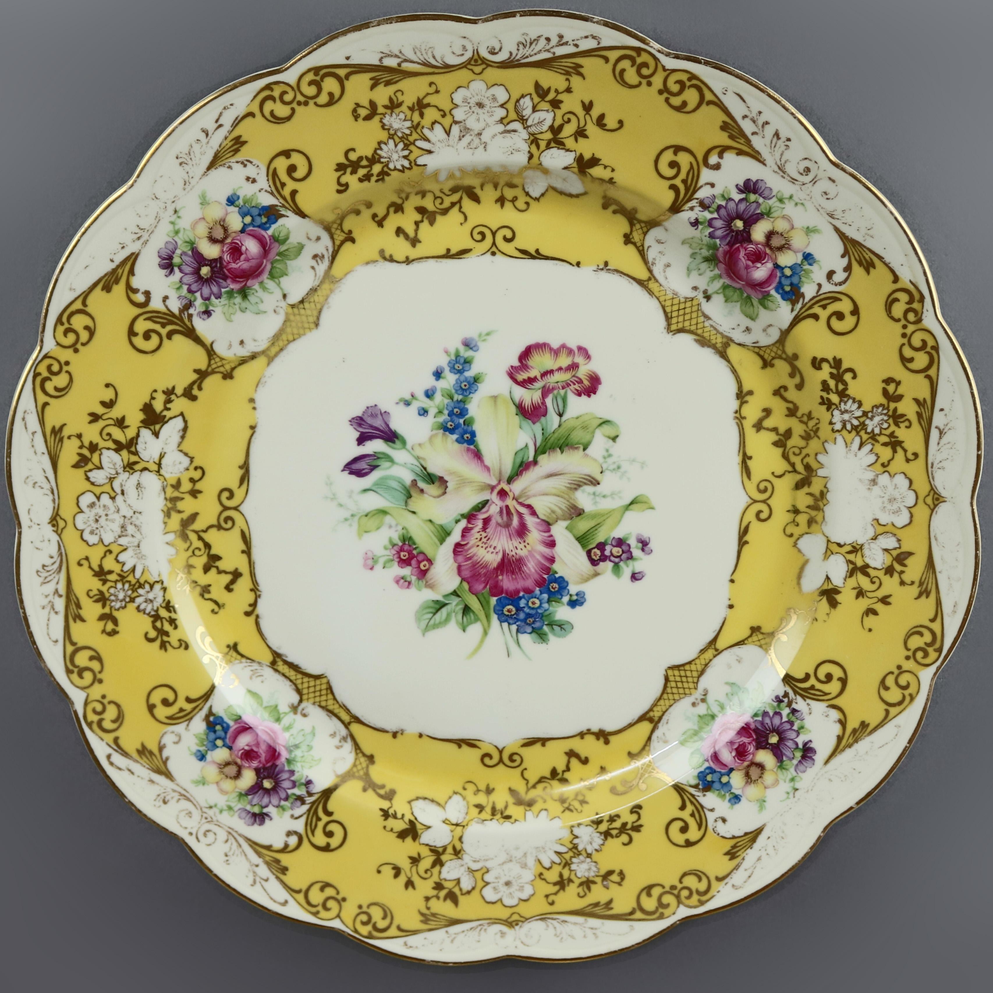 An antique set of ten Bavarian fine china dinner plates by Royal Bayreuth offer scroll and foliate gilt decorated rims with floral reserves and scalloped edges and well with floral spray, en verso maker mark as photographed, 19th