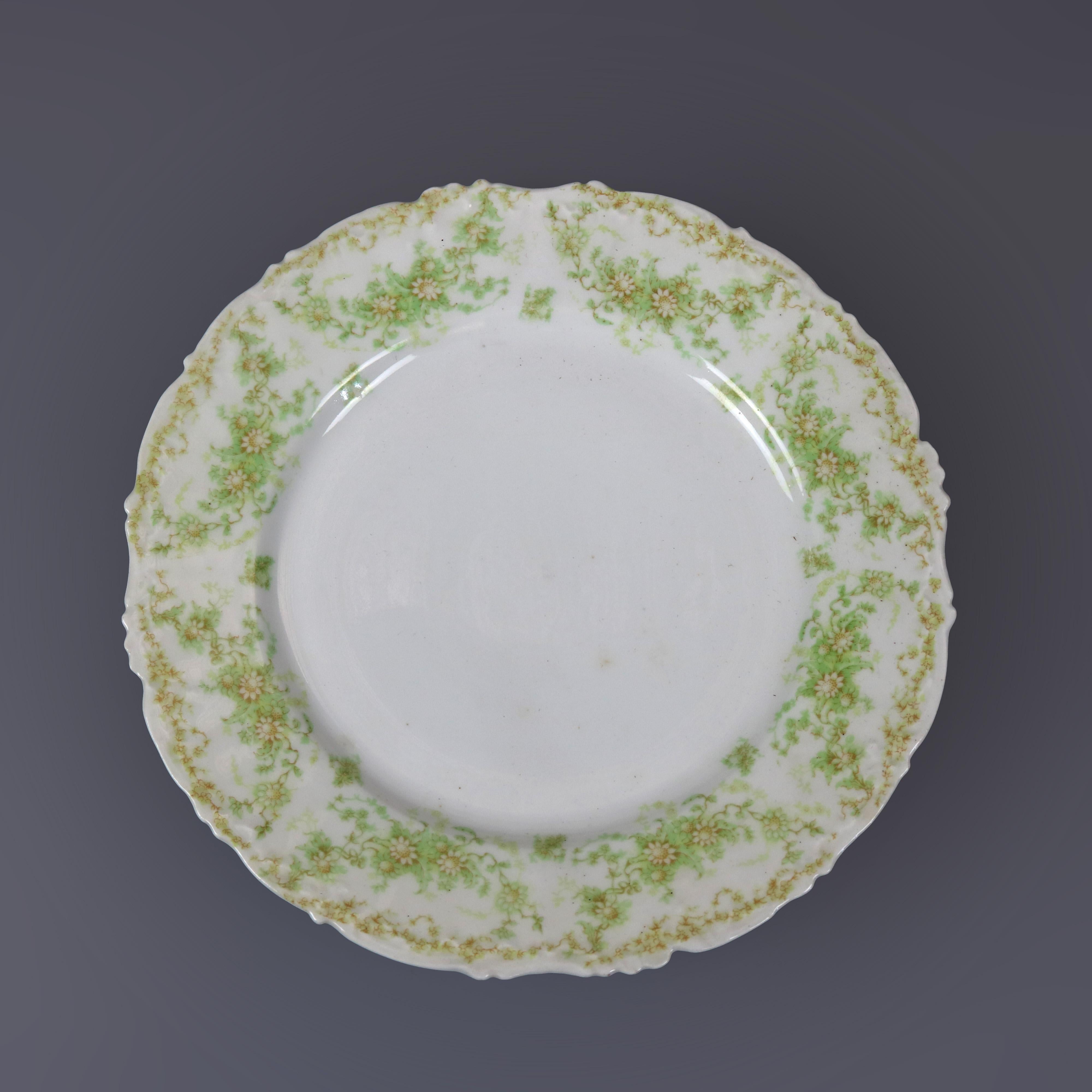 A French antique set of ten fine china dinner plates by Limoges France Elite Works offers shaped rims with foliate and floral decoration, maker mark as photographed, c1900

Measures- 1'' H x 9.5'' W x 9.5'' D.