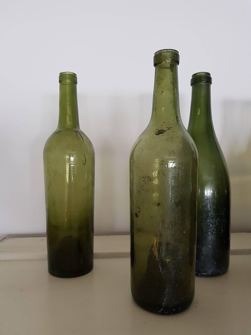 Ten various antique French wine bottles some with a deep soul and two are mold blown, mainly from the 19th century. Very decorative for a small restaurant as a candlestick.

The measurements are,
Depth 8 cm/ 3.1 inch.
Width 8 cm/ 3.1