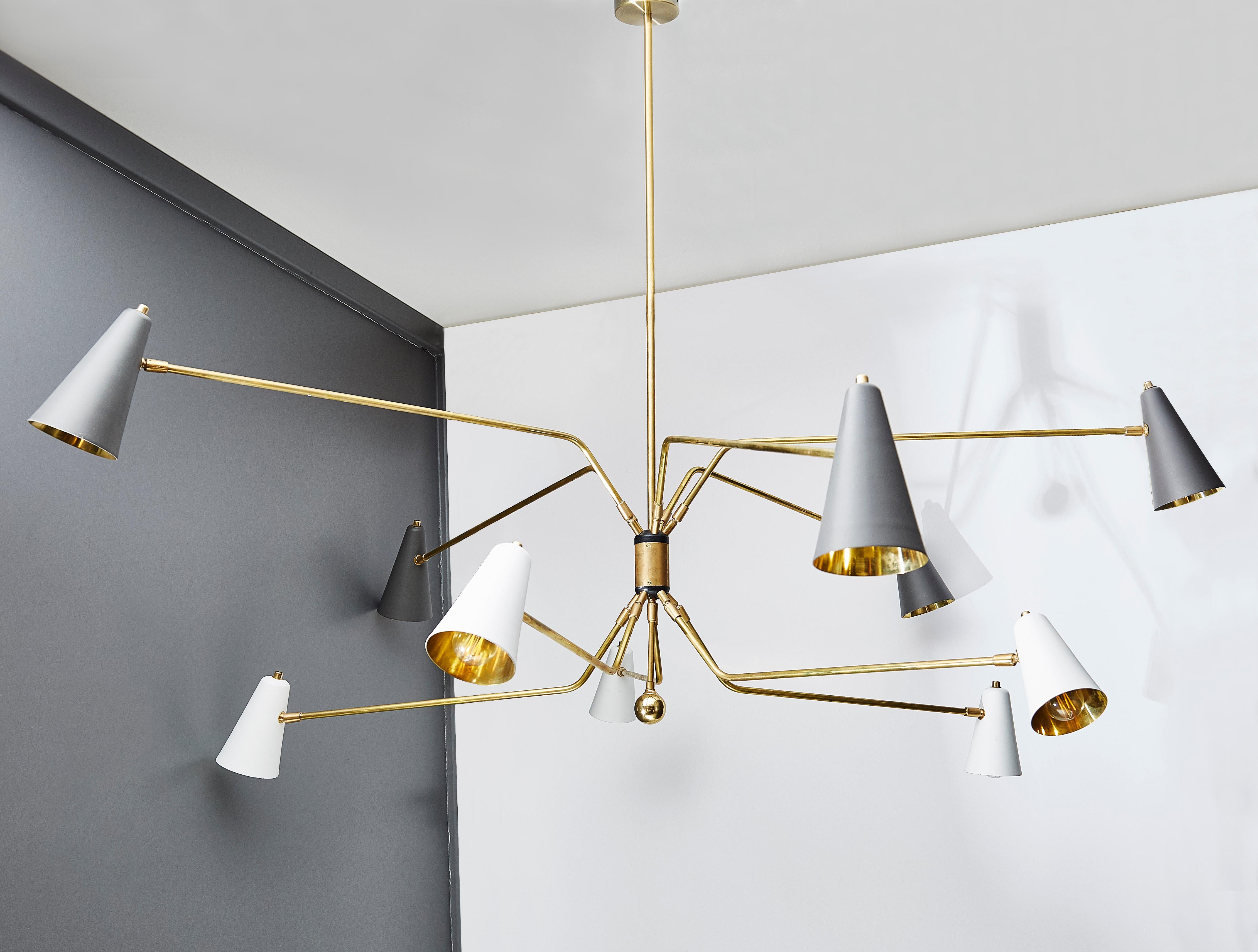 Midcentury style chandelier made exclusively for Glustin Luminaires, ten adjustable arms on two levels each holding a metal cone painted in white or grey.