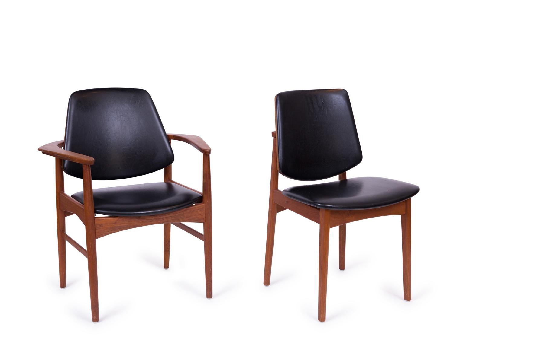 Ten teak, brass and upholstered dining chairs by Arne Hovmand Olsen, circa early 1960s. These examples have sculptural solid teak frames with brass accents and are upholstered in their original black vinyl upholstery. We are happy to upholster these