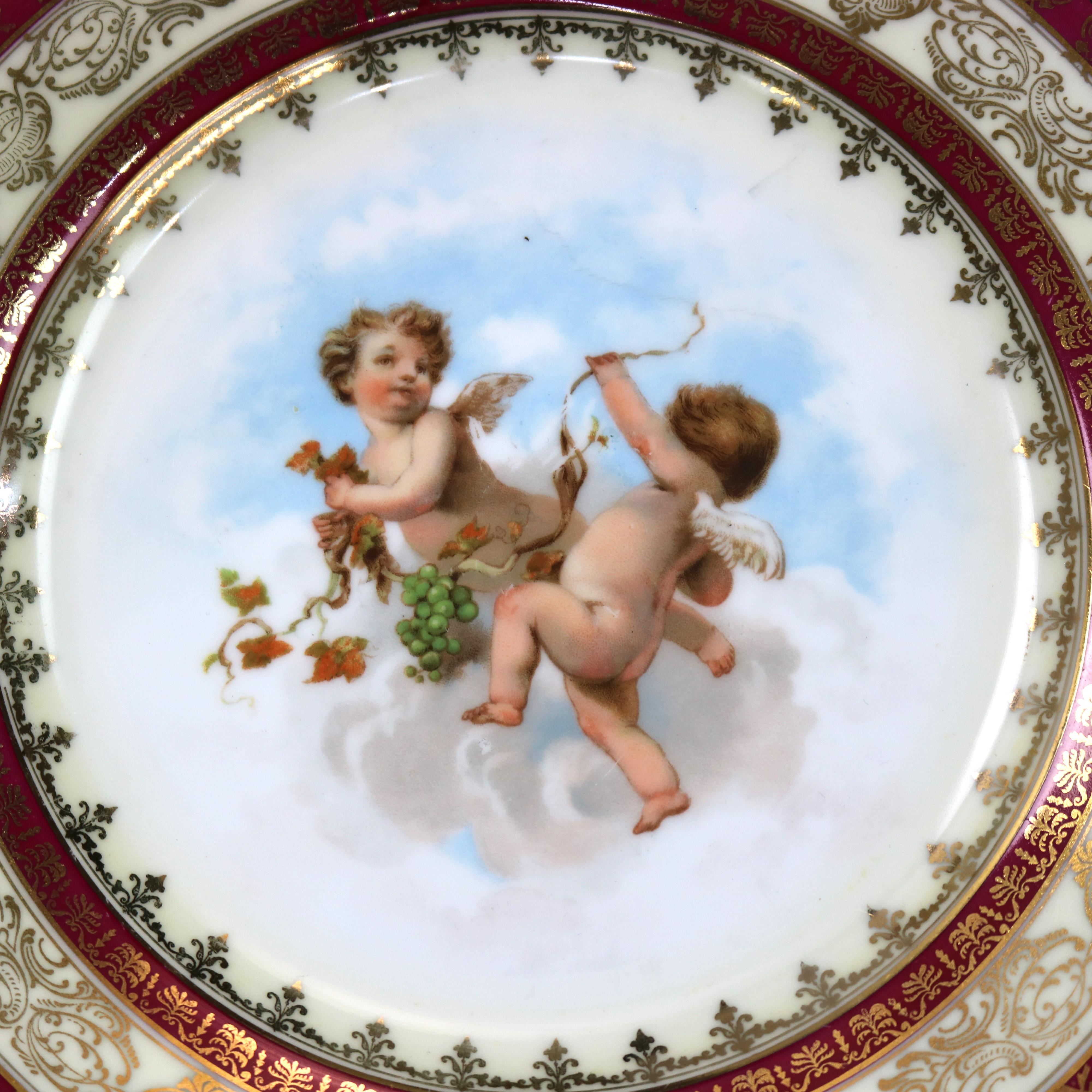 An antique set of ten Austrian Royal Vienna School porcelain luncheon plates by Higgins & Seiter offer gilt decorated rim with well having Classical scenes of cherubs, each plate having a different scene, en verso maker marked as photographed,