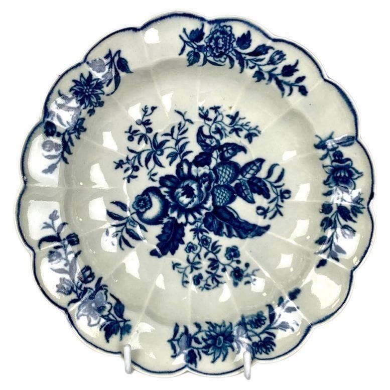 This set of ten 18th-century dishes is beautifully decorated in cobalt blue and white in the Worcester Pine Cone pattern.
The pattern was one of the most popular floral designs made at the Worcester Porcelain factory during the Dr. Wall period of