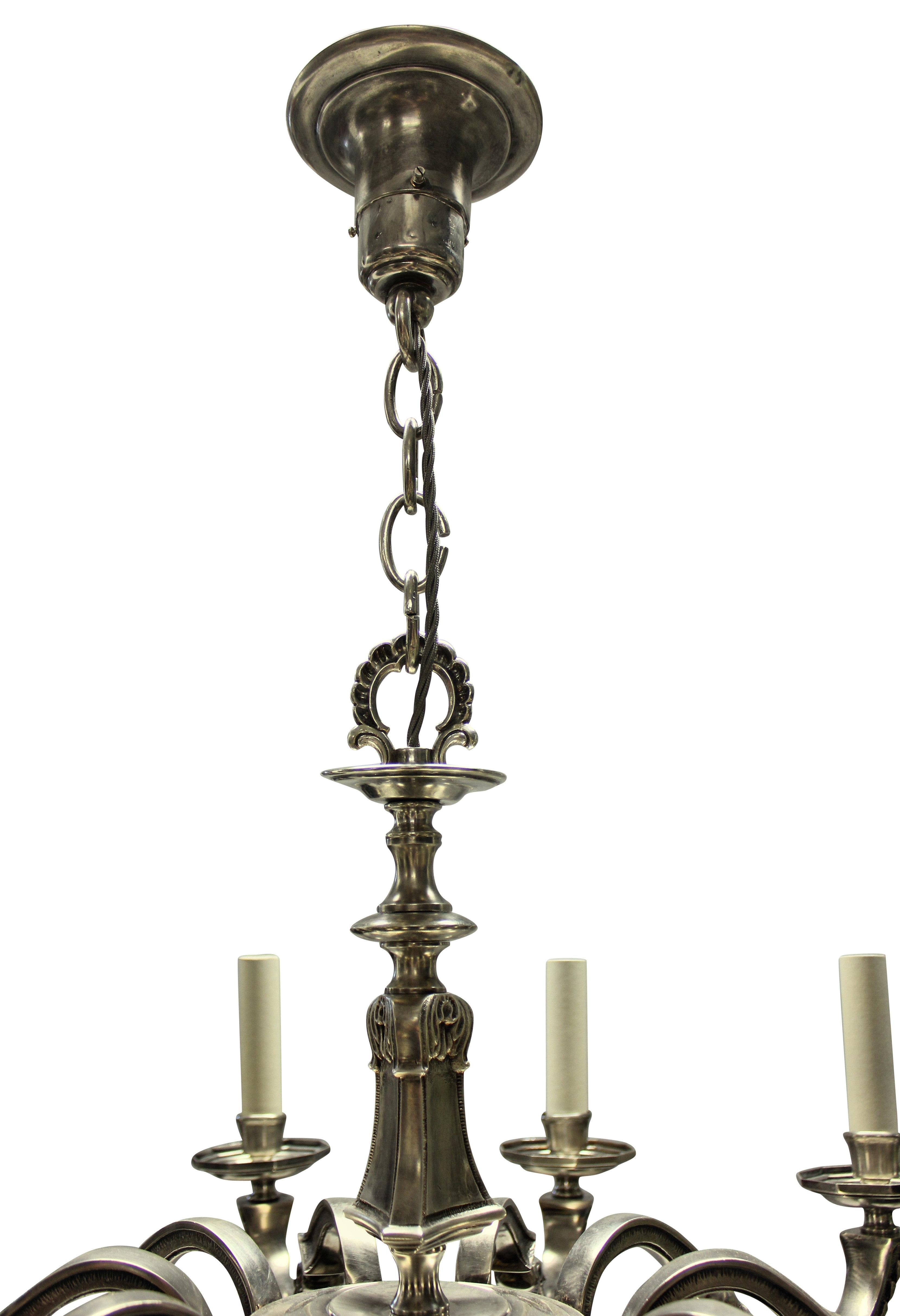 An English neo-classical ten branch silver plated chandelier, which is shallow and suitable for lower ceilings.