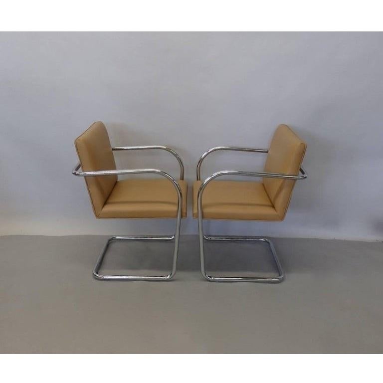 Completely restored set of ten tubular Brno chairs by Mies van der Rohe for Knoll. Professionally re-upholstered in camel color and the chrome is in great condition. 