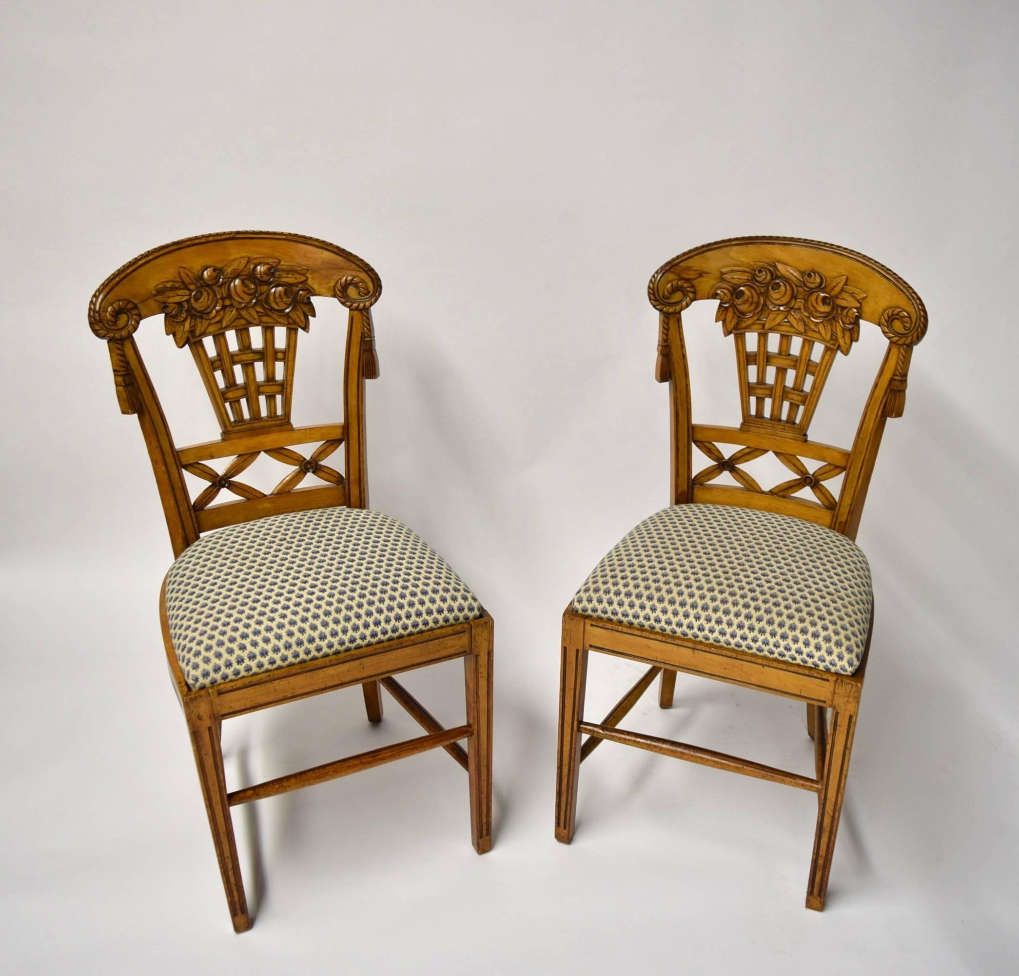 Set of ten beautiful fruitwood dining chairs by André Groult designed in 1912; the set comprises eight side chairs and two armchairs, all with fine woodwork and carved elements throughout. The chairs have backrests that are slightly curved and