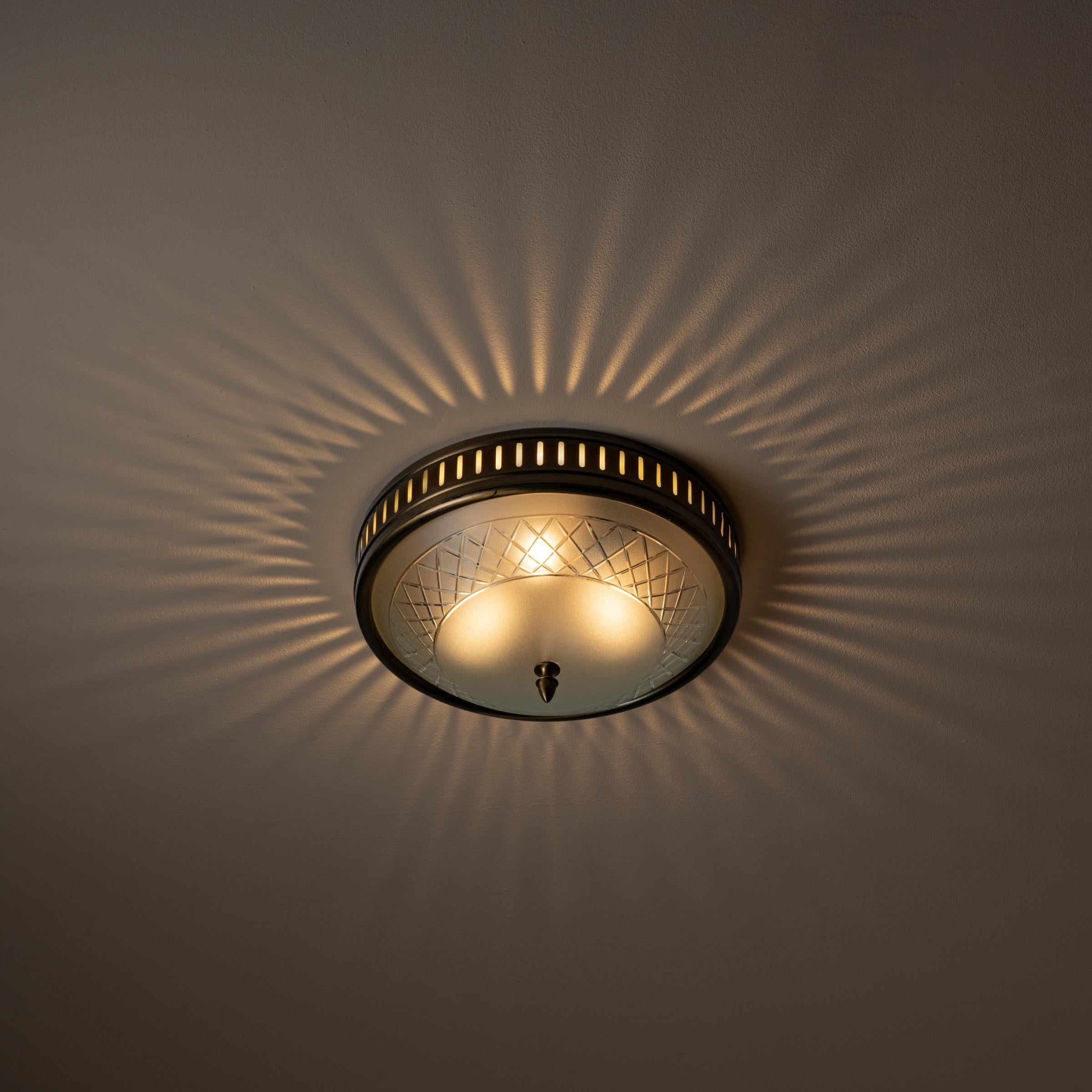 Nine flush mount ceiling lights by Arredoluce. Manufactured in Italy, circa 1940's. Engraved glass, brass, Rewired for U.S. standards. We recommend three E27 40w maximum bulbs per fixture. Bulbs not included. There are 8 available even though image