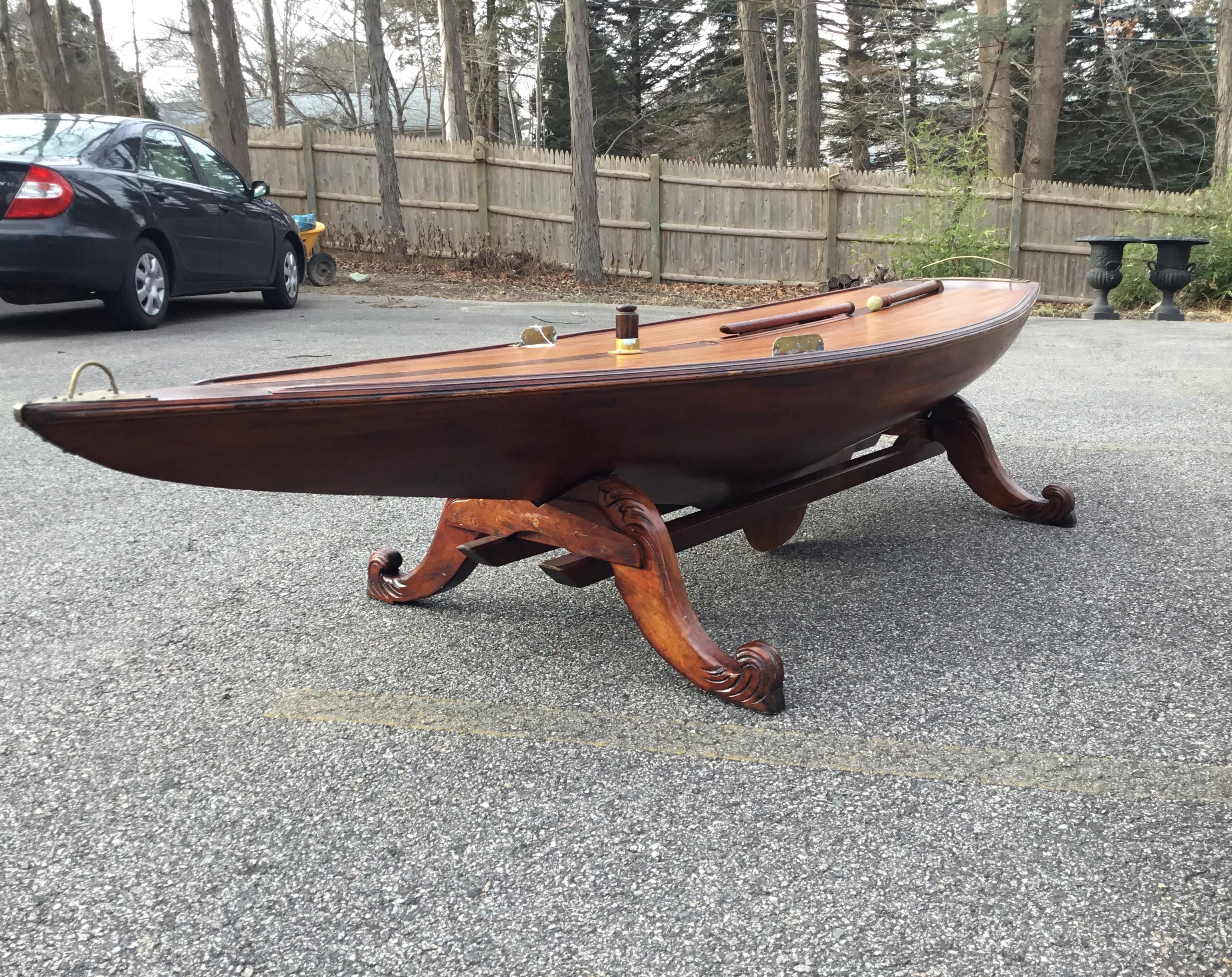 Ten foot vintage yacht model hull with planked deck, dropped keel, mast collar, set into a custom cradle. Perfect for use as a long cocktail table, or raise it to use for dining or a desk. Circa 1890.

Overall dimensions: 120 long by 31 wide by 21