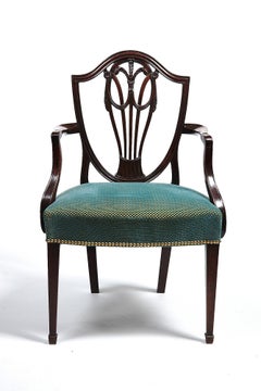 Ten George III Mahogany Dining Chairs in the Hepplewhite Style