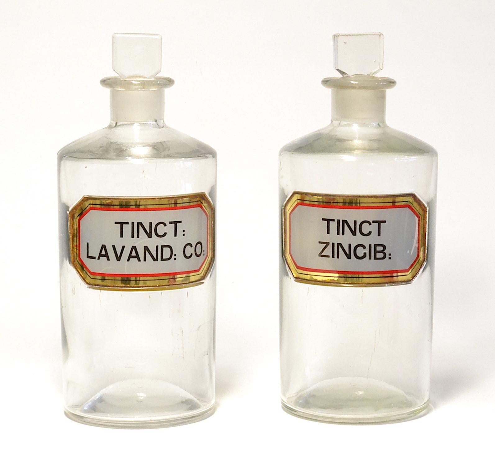 Ten glass apothecary jars with ground glass stoppers and enamel glass nomenclature. Three sizes of glass jar.

Measures: 2 of f9