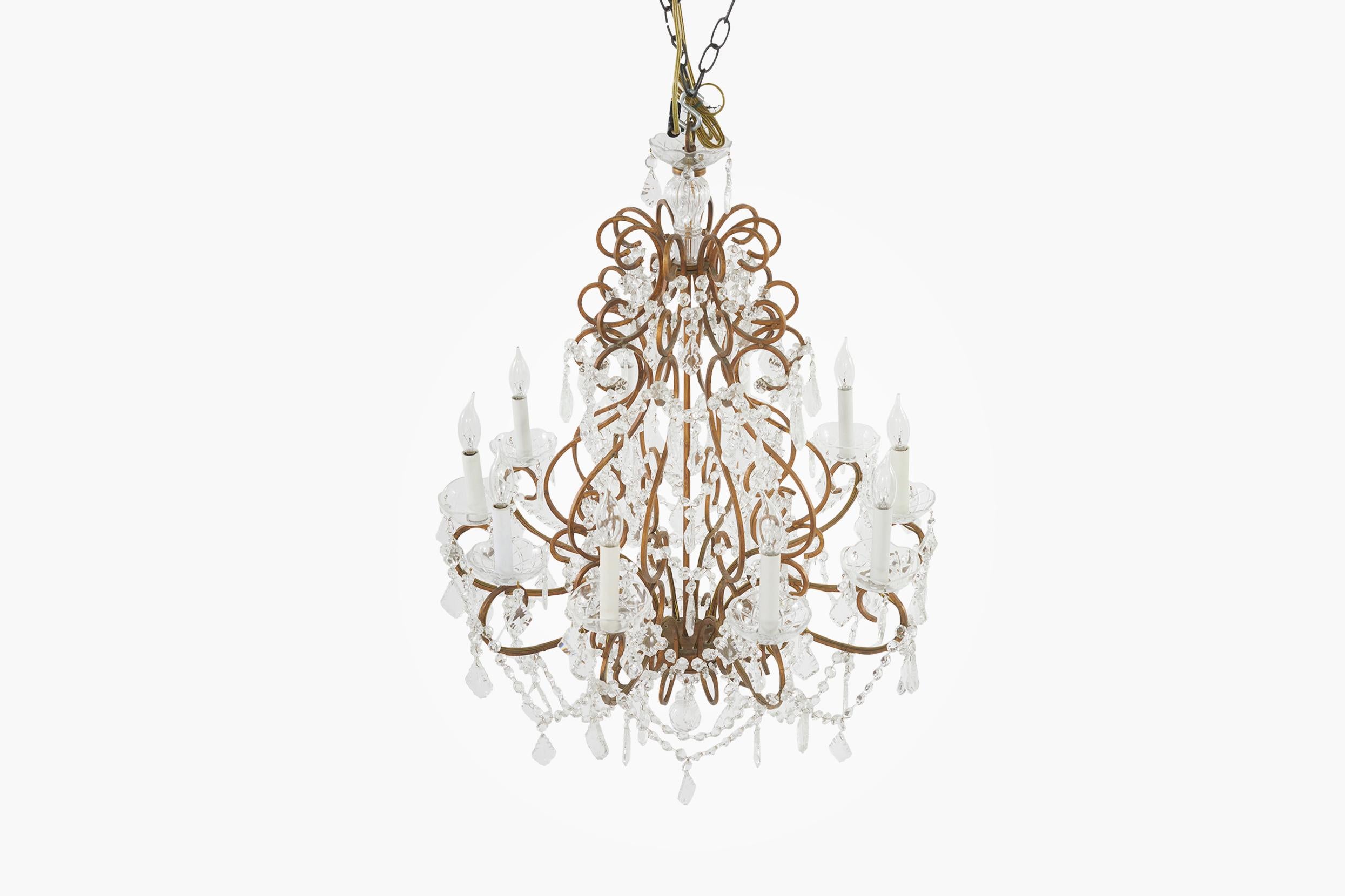 Late 19th century French Rococo style cut crystal / brass frame ten-light hanging chandelier. The chandelier is in great working condition. Rewired for US used. The chandelier stands about 36 inches long x 28 inches diameter without the hanging