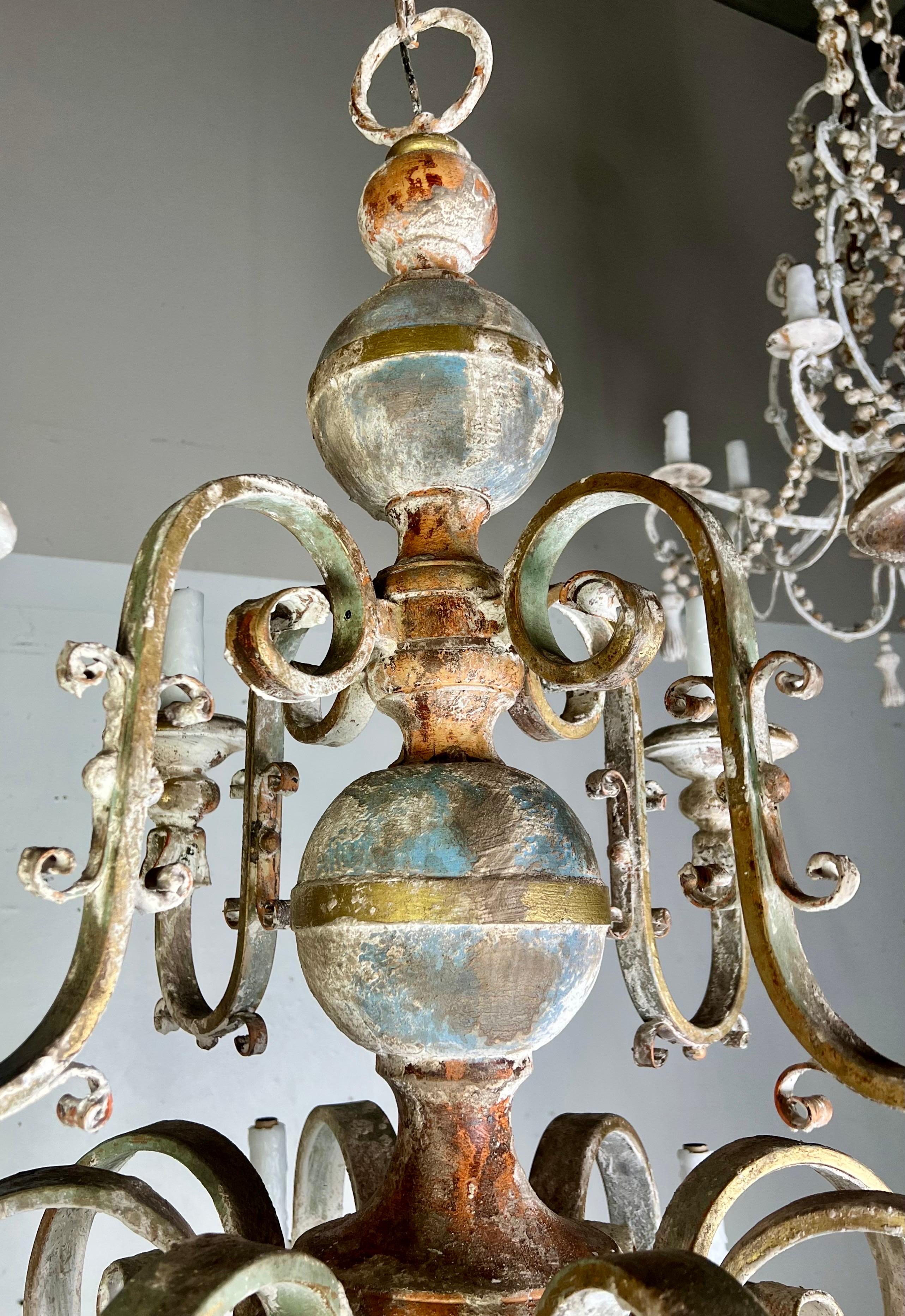 Ten Light Spanish Wrought Iron & Wood Painted Chandelier In Distressed Condition For Sale In Los Angeles, CA
