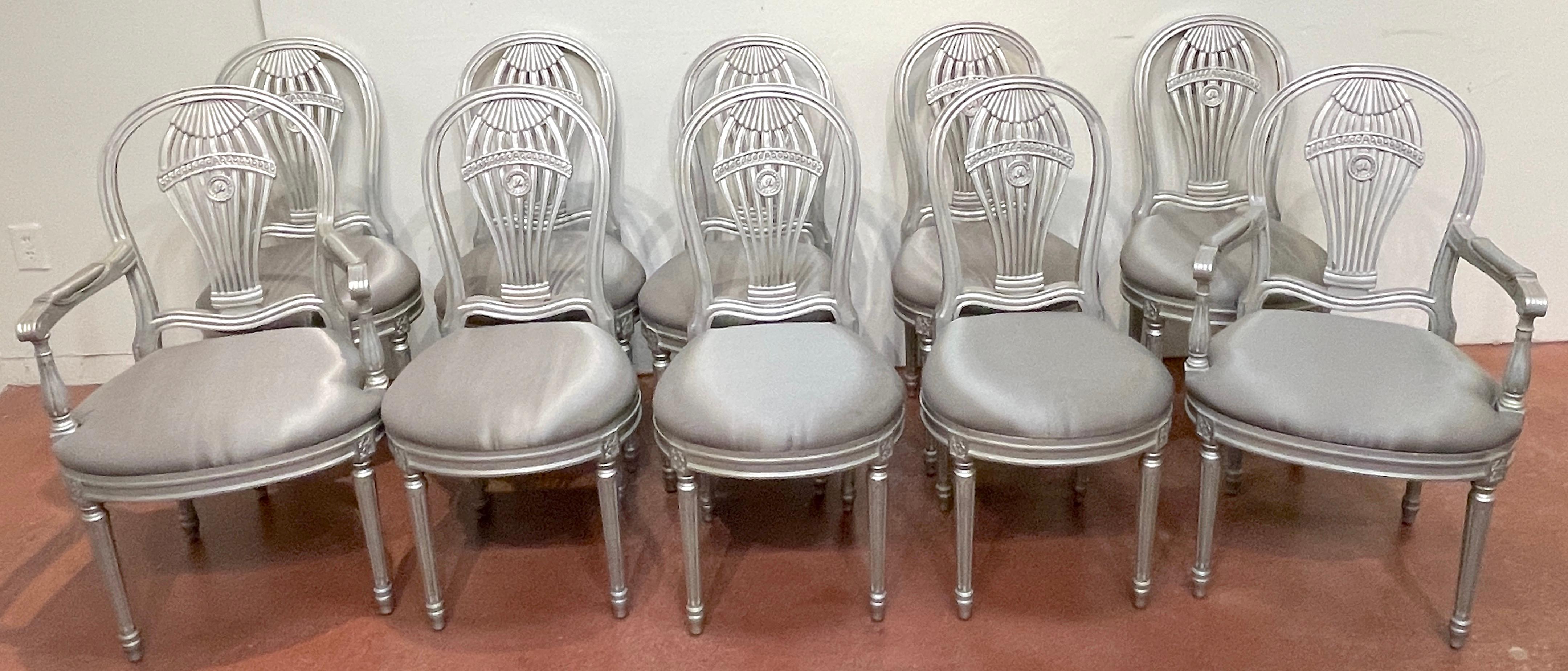 Ten Maison Jansen Style Silverleaf 'Montgolfier' Hot-Air Balloon Dinning Chairs 
France, Mid -20th Century 
A set of ten dinning chairs consisting of two arm and 8 side chairs, after the original chair by Jean-Baptiste Demay . This chair was offered