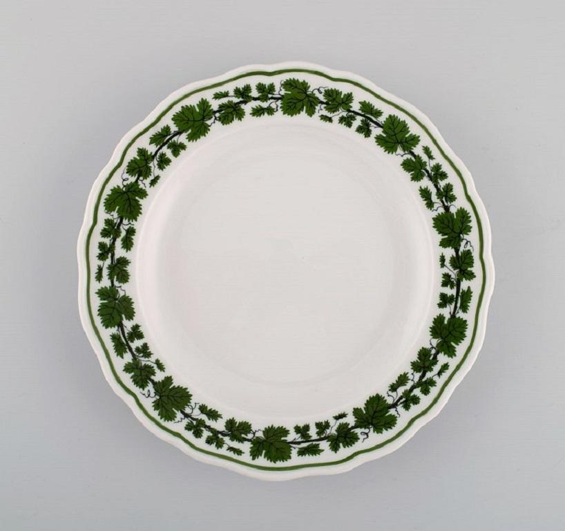 Ten Meissen Green Ivy Vine Leaf plates in hand-painted porcelain. 1940s.
Nine flat and one deep plate.
Largest plate diameter: 20.5 cm
Deep plate measures: 23 x 4.5 cm.
In excellent condition.
Stamped.
1st factory quality.