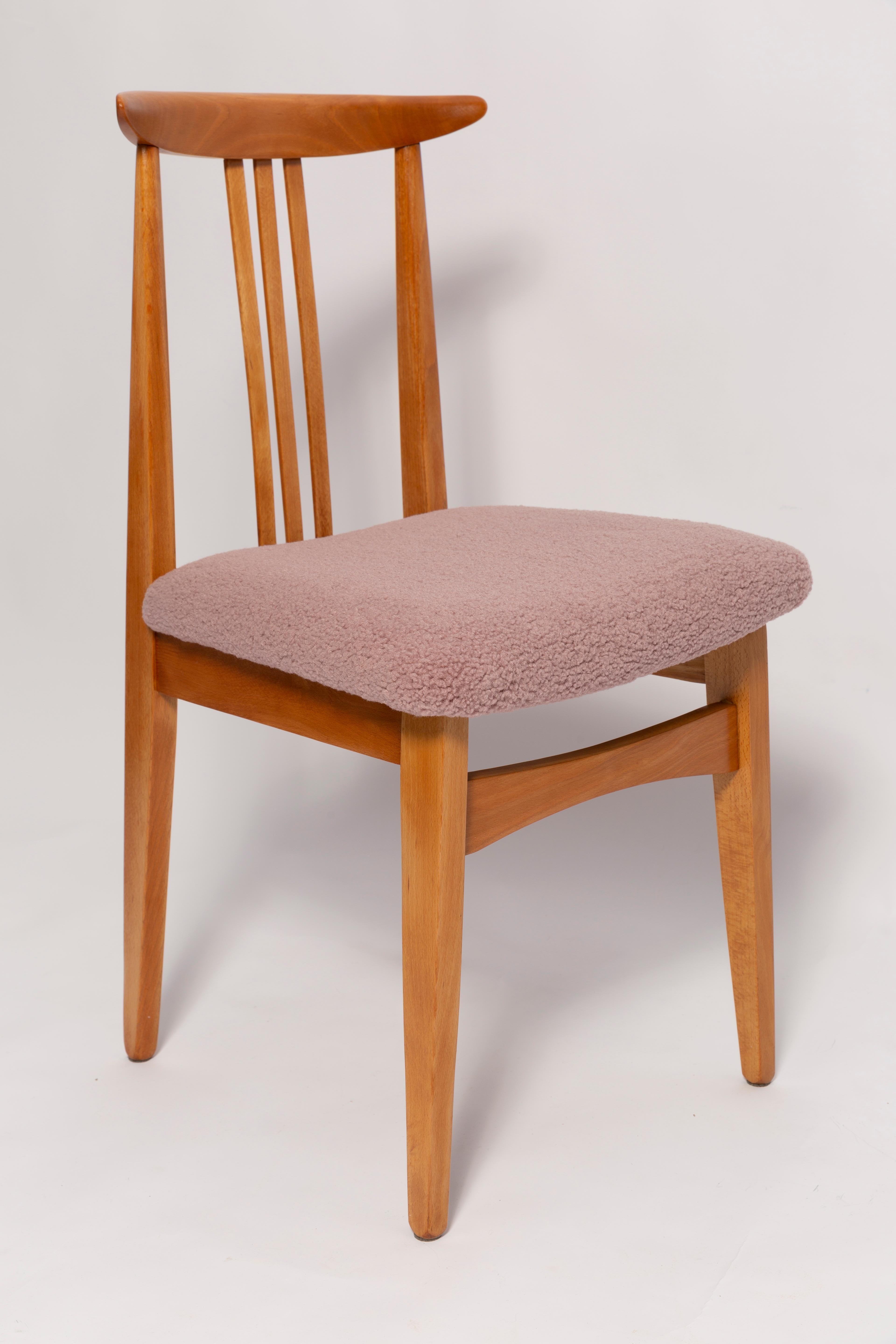 A beautiful beech chair designed by M. Zielinski, type 200 / 100B. Manufactured by the Opole Furniture Industry Center at the end of the 1960s in Poland. The chair is after undergone a complete carpentry and upholstery renovation. Seats covered with