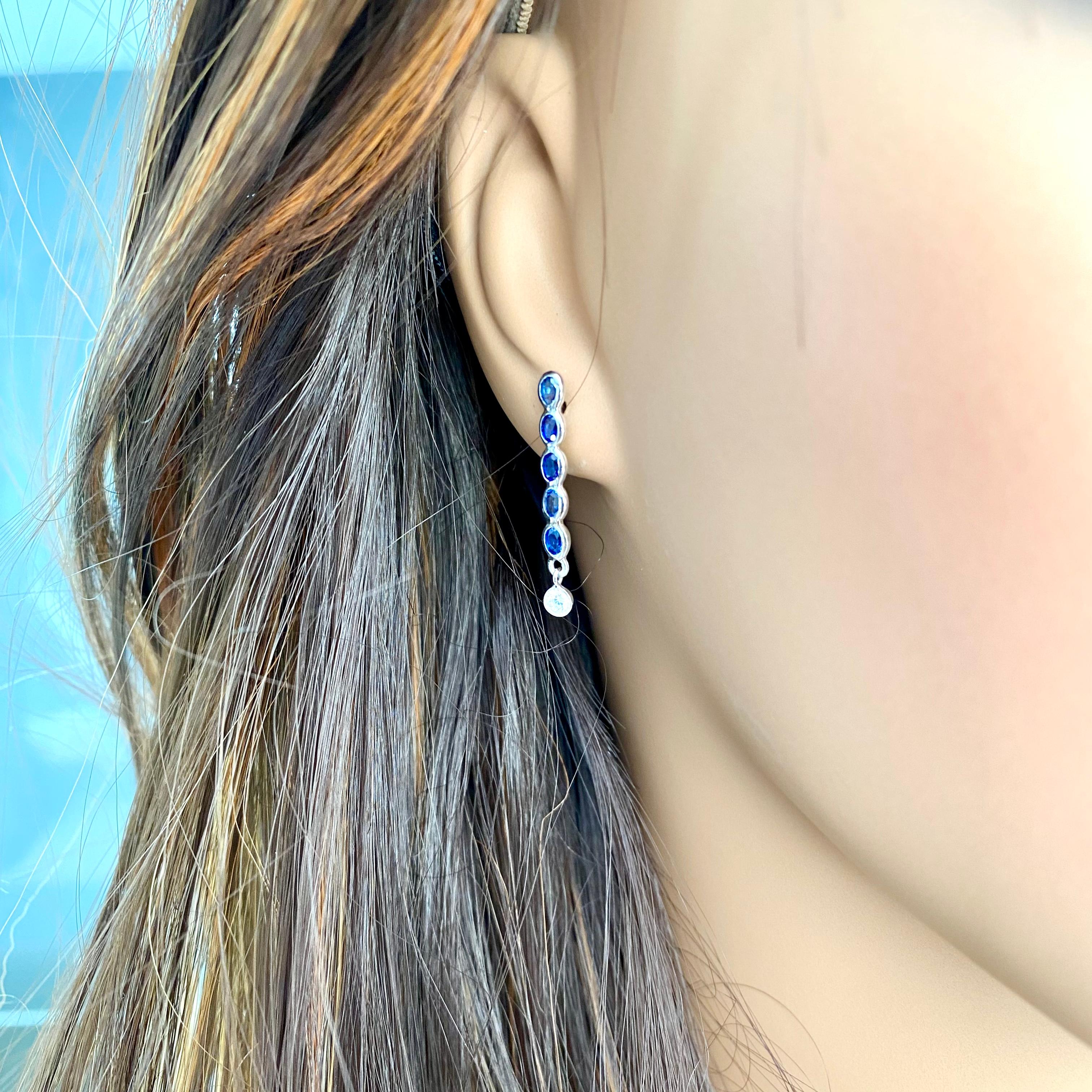 two diamond drop earrings