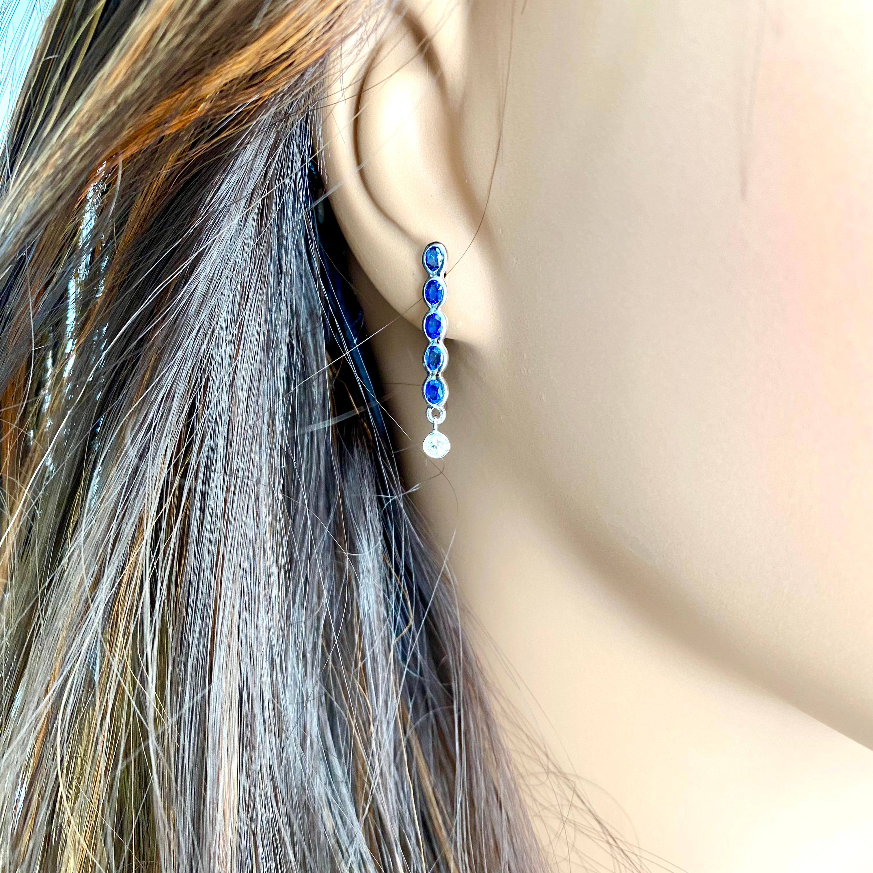 Ten Oval Shaped Sapphire Drop and Two Diamonds Linear White Gold Drop Earrings 1