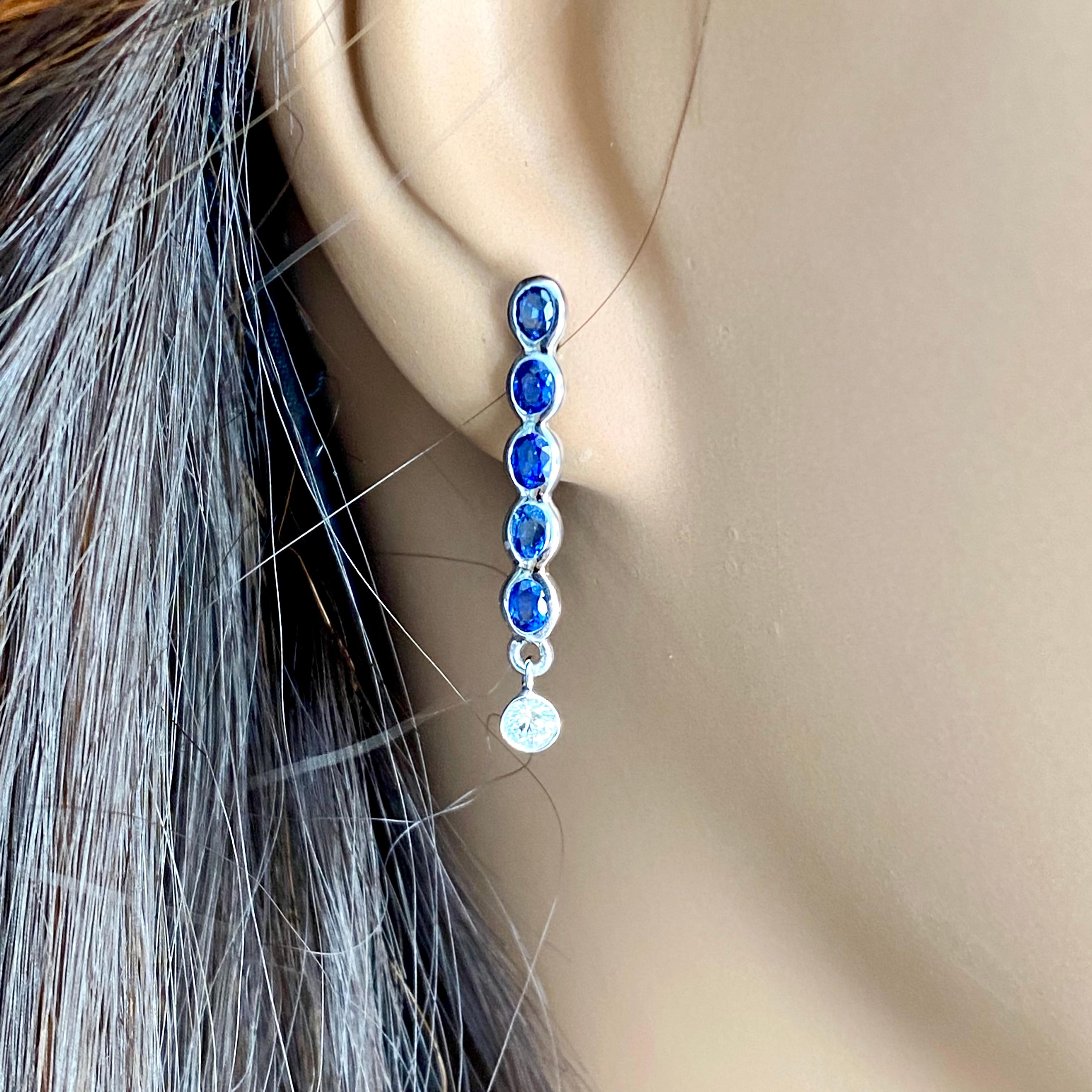 Ten Oval Shaped Sapphire Drop and Two Diamonds Linear White Gold Drop Earrings 2