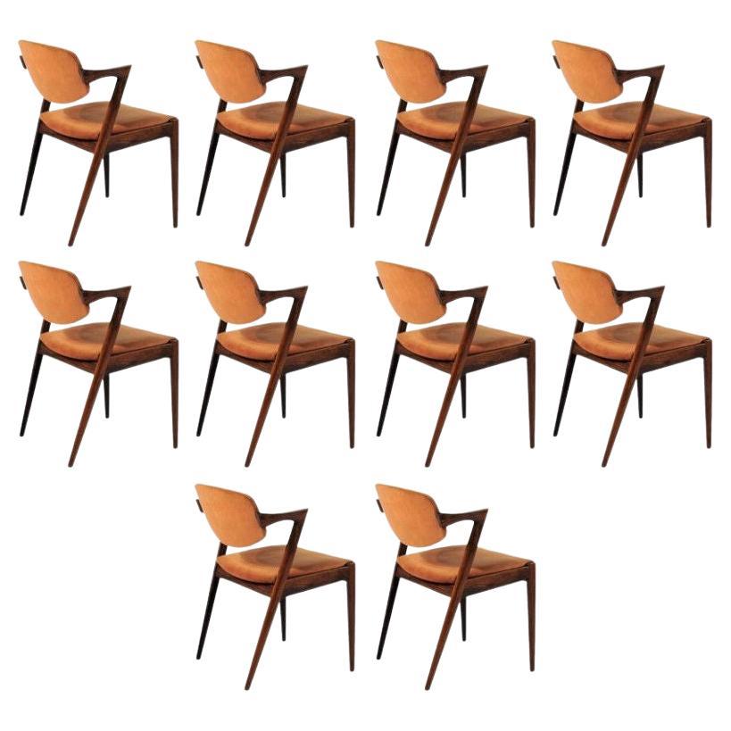 Ten Restored Kai Kristiansen Rosewood Dining Chairs Including Custom Upholstery For Sale