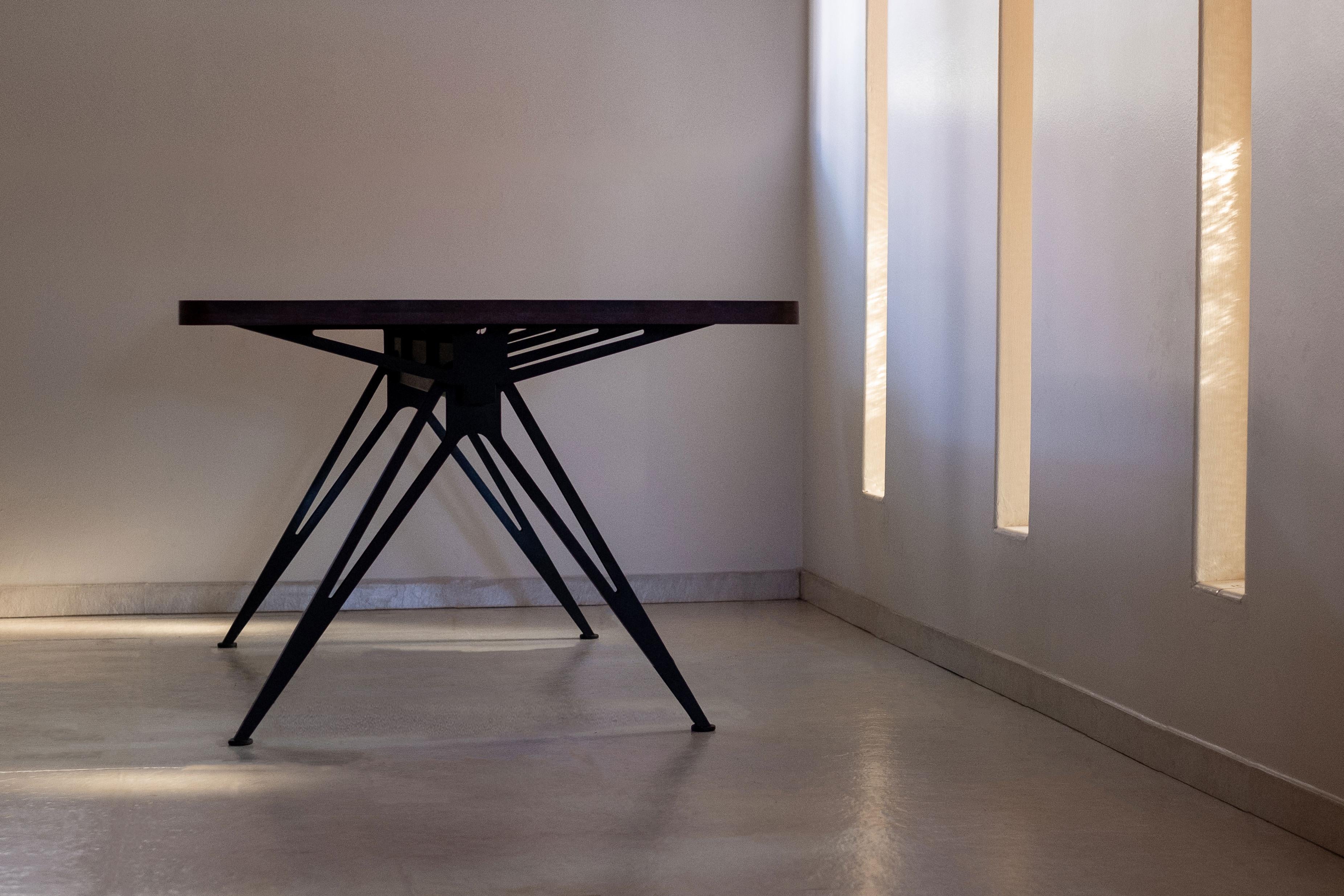 Industrial Spine Table with wooden top and black steel base by Manna Design Studio For Sale