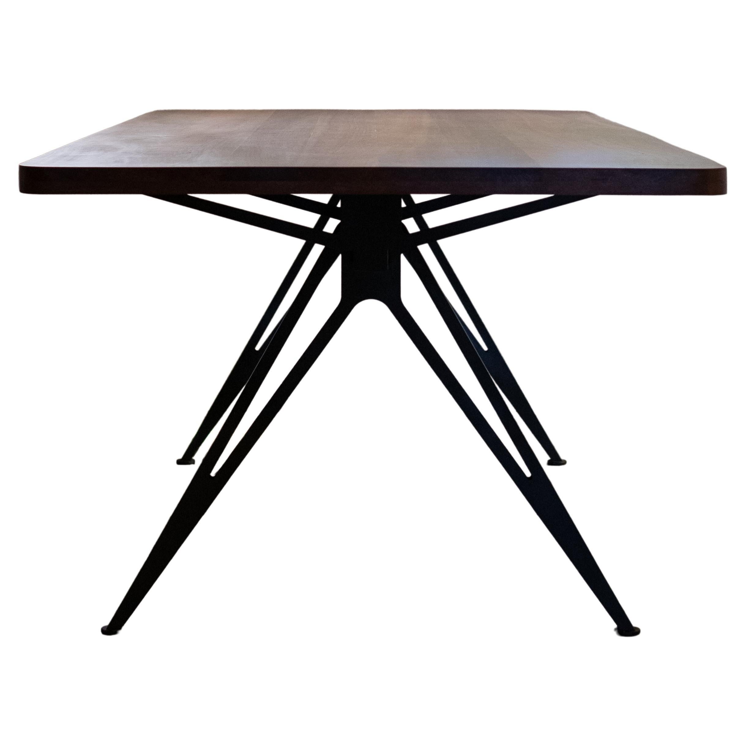 Spine Table with wooden top and black steel base by Manna Design Studio