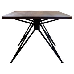 Spine Table with wooden top and black steel base by Manna Design Studio