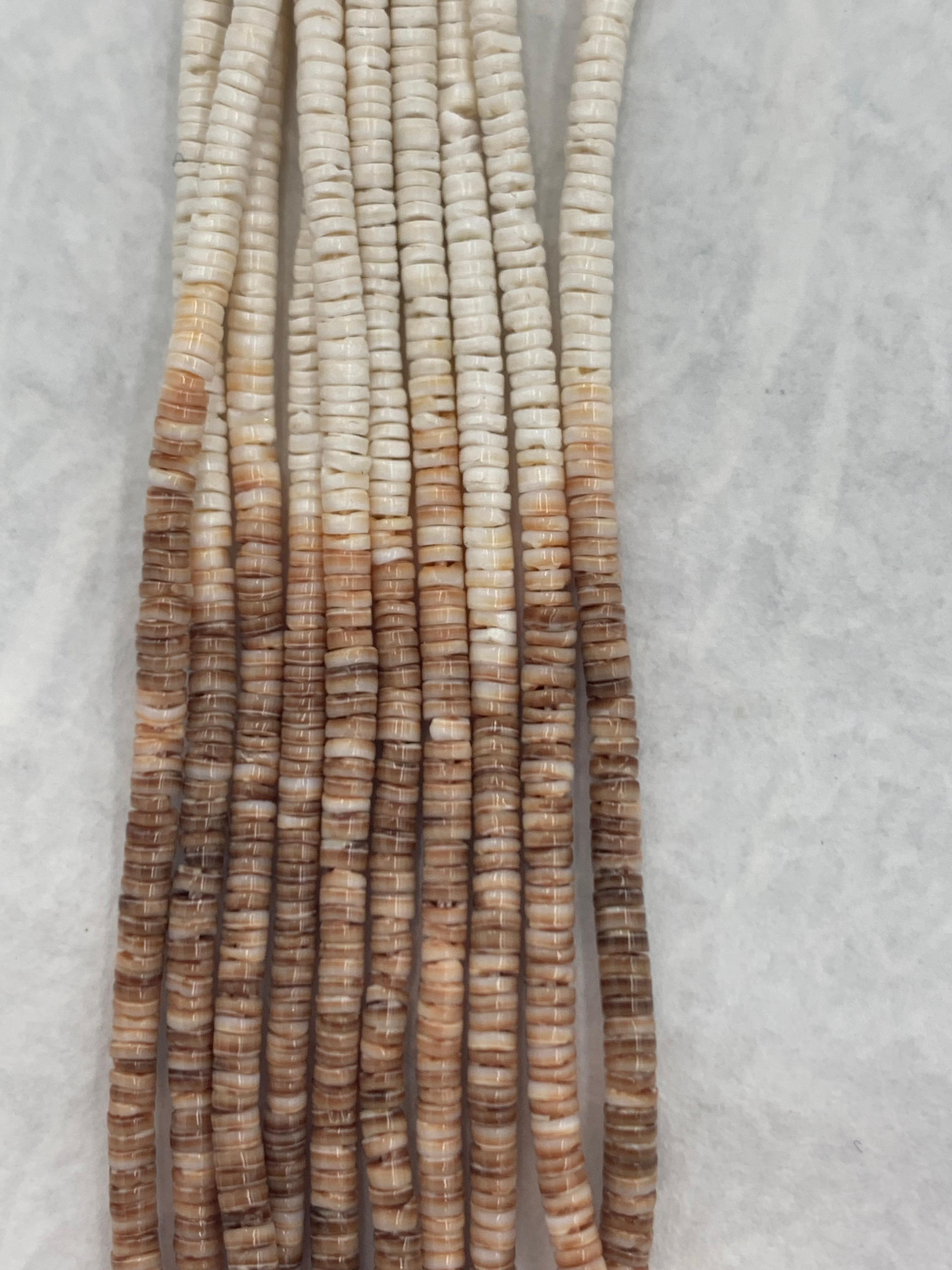 Santo Domingo Pueblo hand made necklace with ten strands of fresh water white and brown ombre shell heishi shells. The heishi beautifully graduates in color from dark brown going to light brown tan and finishing with a marvelous light tan white
