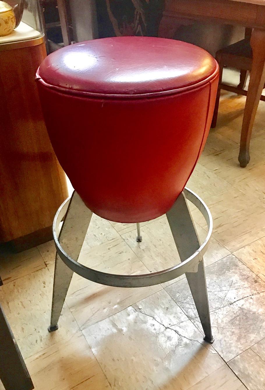 Ten Swedish stools by Johanson Design. Stools have red vinyl seats with metal frames.