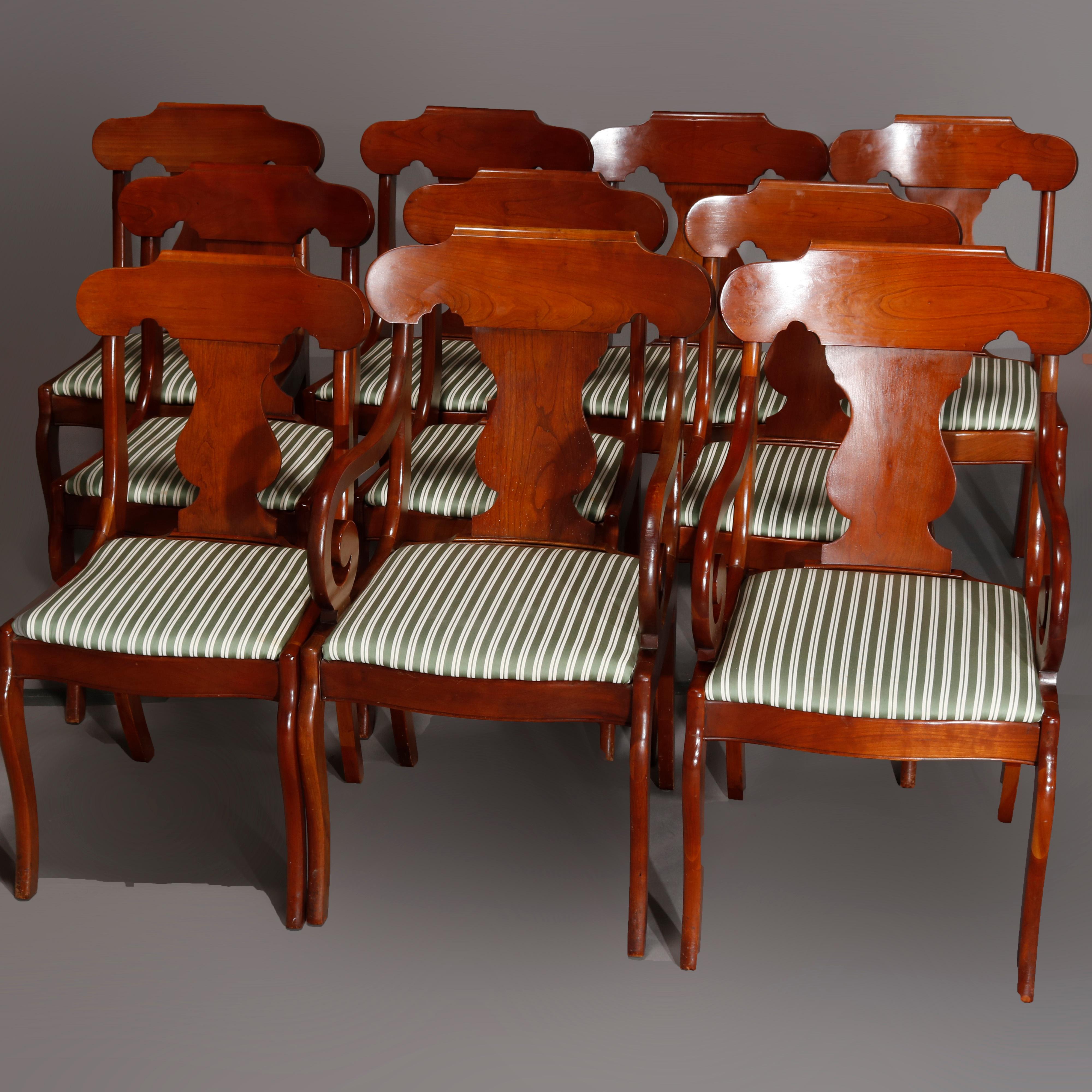 A vintage set Pennsylvania House dining room chairs offer cherry construction in gondola form having shaped crest rail over stylized urn form back slat with scroll form arms surmounting upholstered seats raised on cabriole legs, set includes two