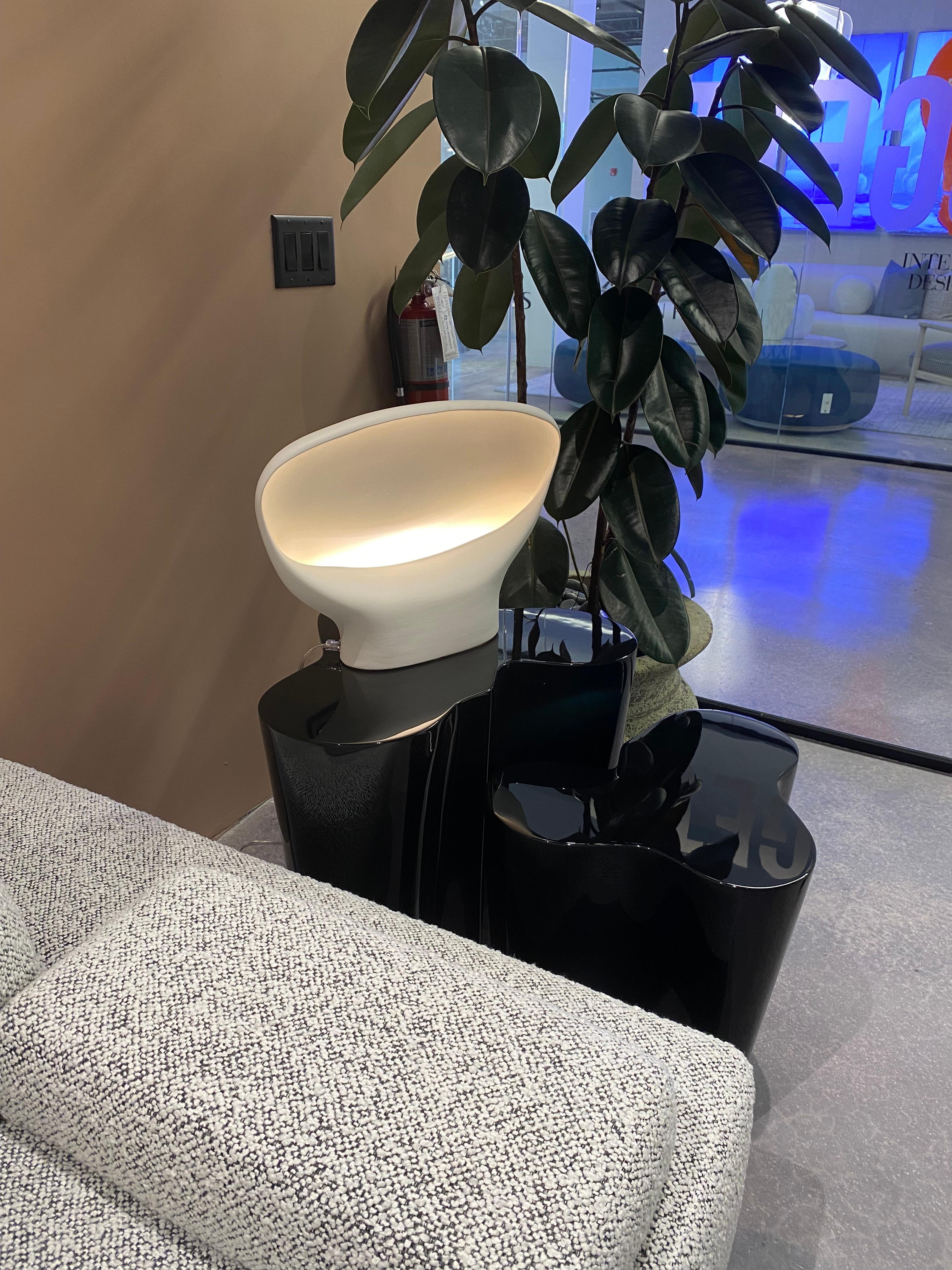 Sculpture or lamp or both? The Teneum table light, made in Italy by Venetian artisans of white matte ceramic, has a soft, organic feel. Decorated with gold leaf on the interior, the fixture radiates the perfect glow of light.

Product Type:
Table
