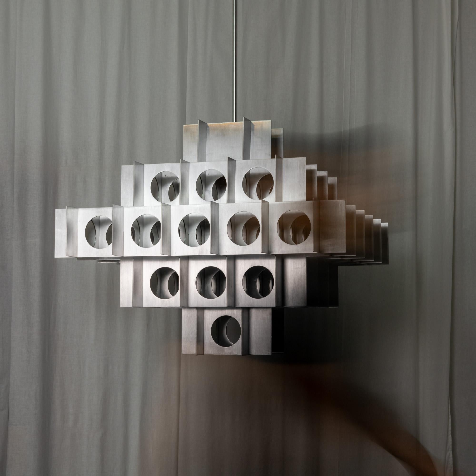 TENFOLD 5 TIER in Polished Nickel by Luft Tanaka Studio

Composed of interlocking  perforated sheetmetal panels, the Tenfold Series is inspired by the architectural styles and art movements of the 1970s. 

Made to order. Assembled and shipped from
