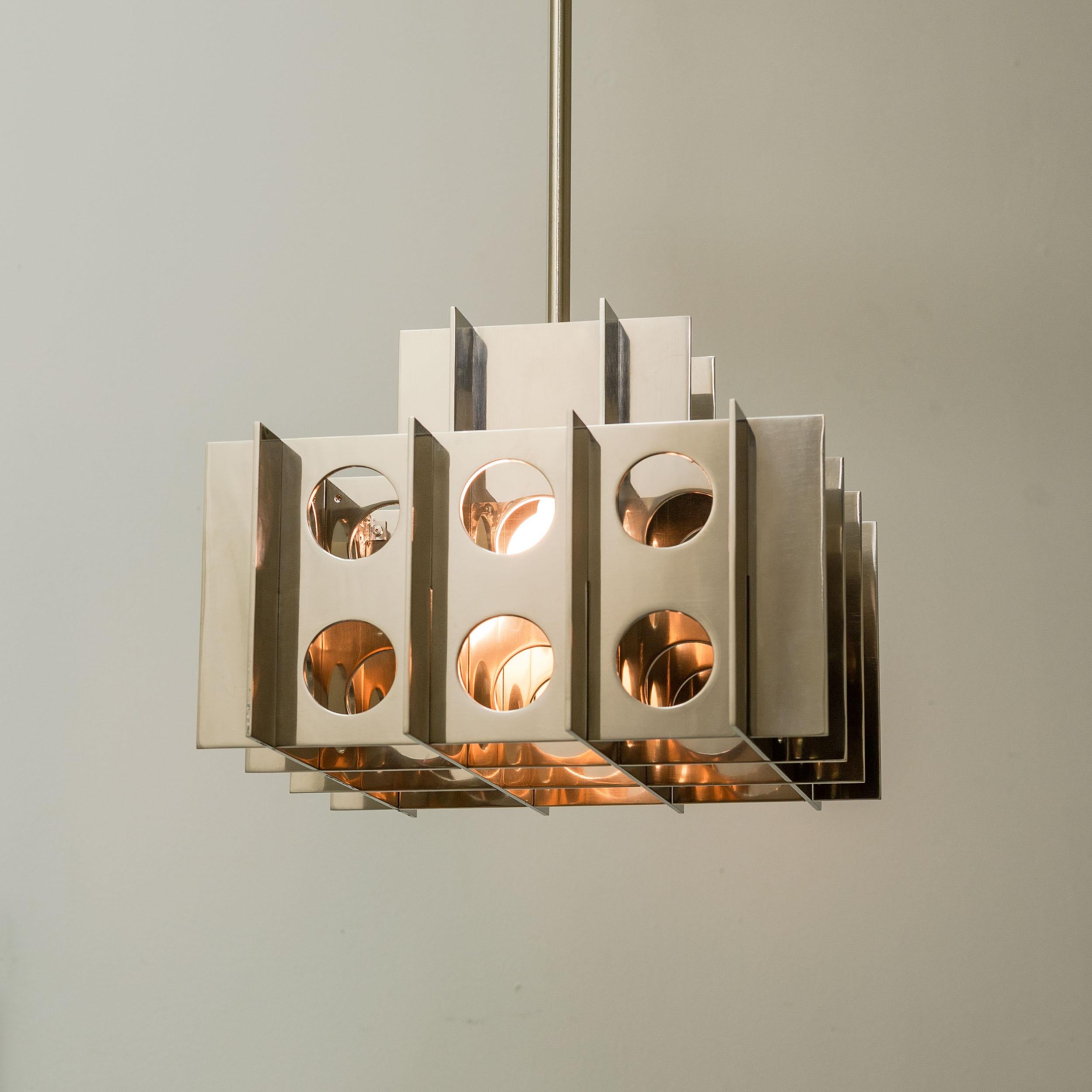 TENFOLD PENDANT 3TA 18inch, Polished Nickel by Luft Tanaka Studio

Composed of interlocking mirror polished sheetmetal panels, the Tenfold Series is inspired by brutalism and the architectural styles of the 1970s. 

Made to order. Assembled and