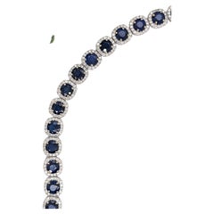 Tennis Bracelet | 23 cts of Round Faceted Blue Sapphires w Natural Diamond Halos
