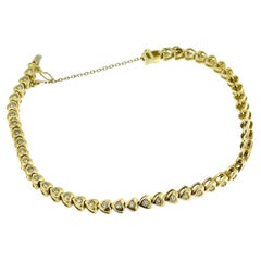 Bracelet tennis 47 cœurs en or jaune et diamants 